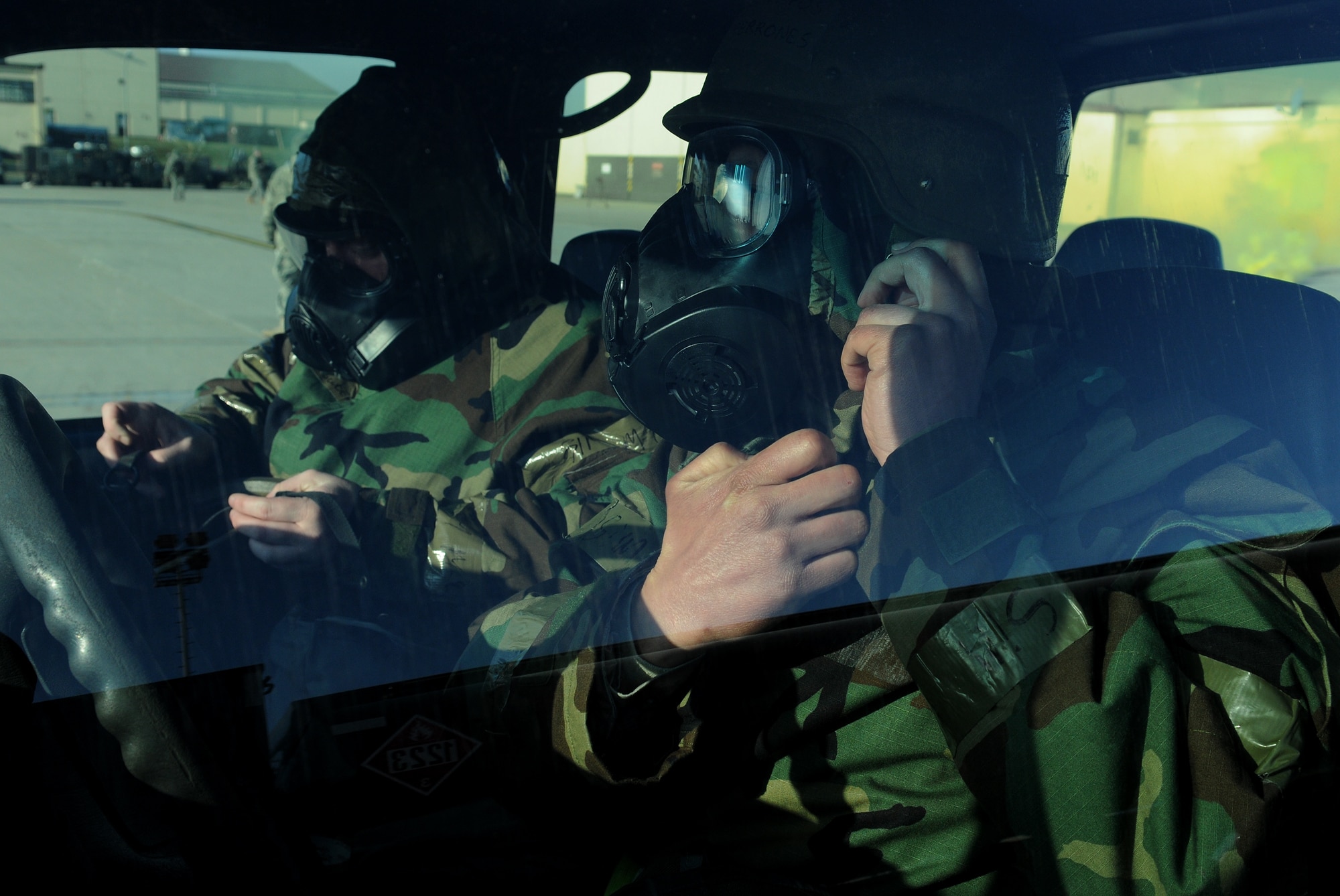 SPANGDAHLEM AIR BASE, Germany – Members of the 52nd Logistics Readiness Squadron race to secure their chemical protective gear after a simulated mortar attack here March 3. Members of the 52nd Fighter Wing participated in Operation Saber Crown 10-04 to evaluate the wing’s ability to operate in a chemical, biological, radiological, nuclear and explosive environment and to prepare the wing for the NATO force evaluation this summer. (U.S. Air Force photo/Senior Airman Nathanael Callon)
