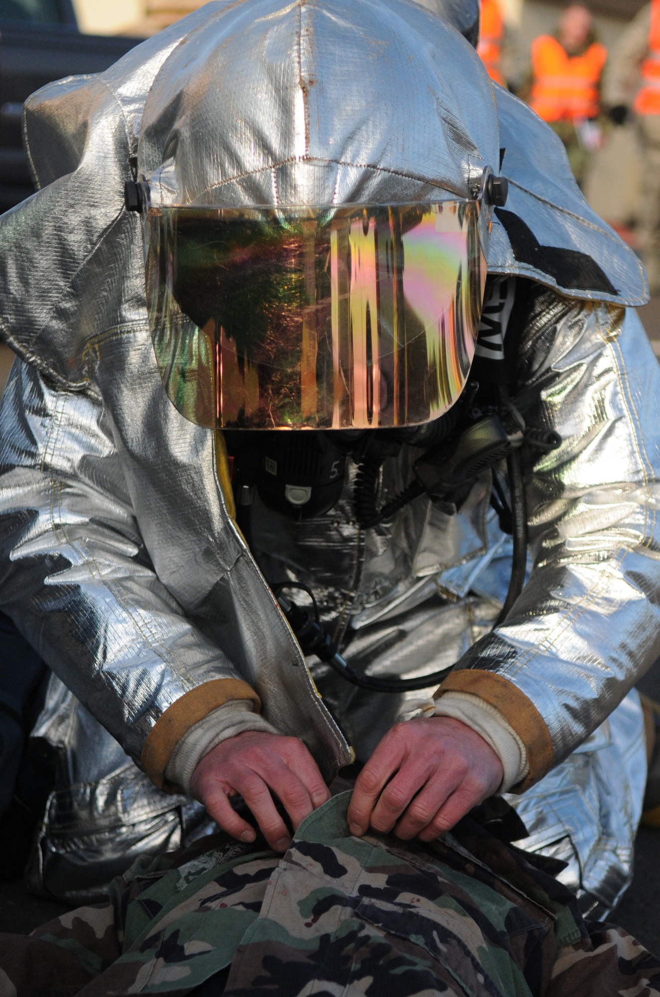 SPANGDAHLEM AIR BASE, Germany – A 52nd Civil Engineer Squadron firefighter performs self-aid and buddy care on a simulated fire victim during Operation Saber Crown 10-04 March 2. The Phase II exercise evaluated the wing’s SABC execution, emergency response and chemical, biological, radiological, nuclear, and explosive procedures to prepare for the upcoming NATO force evaluation. (U.S. Air Force photo/Airman 1st Class Staci Miller) 