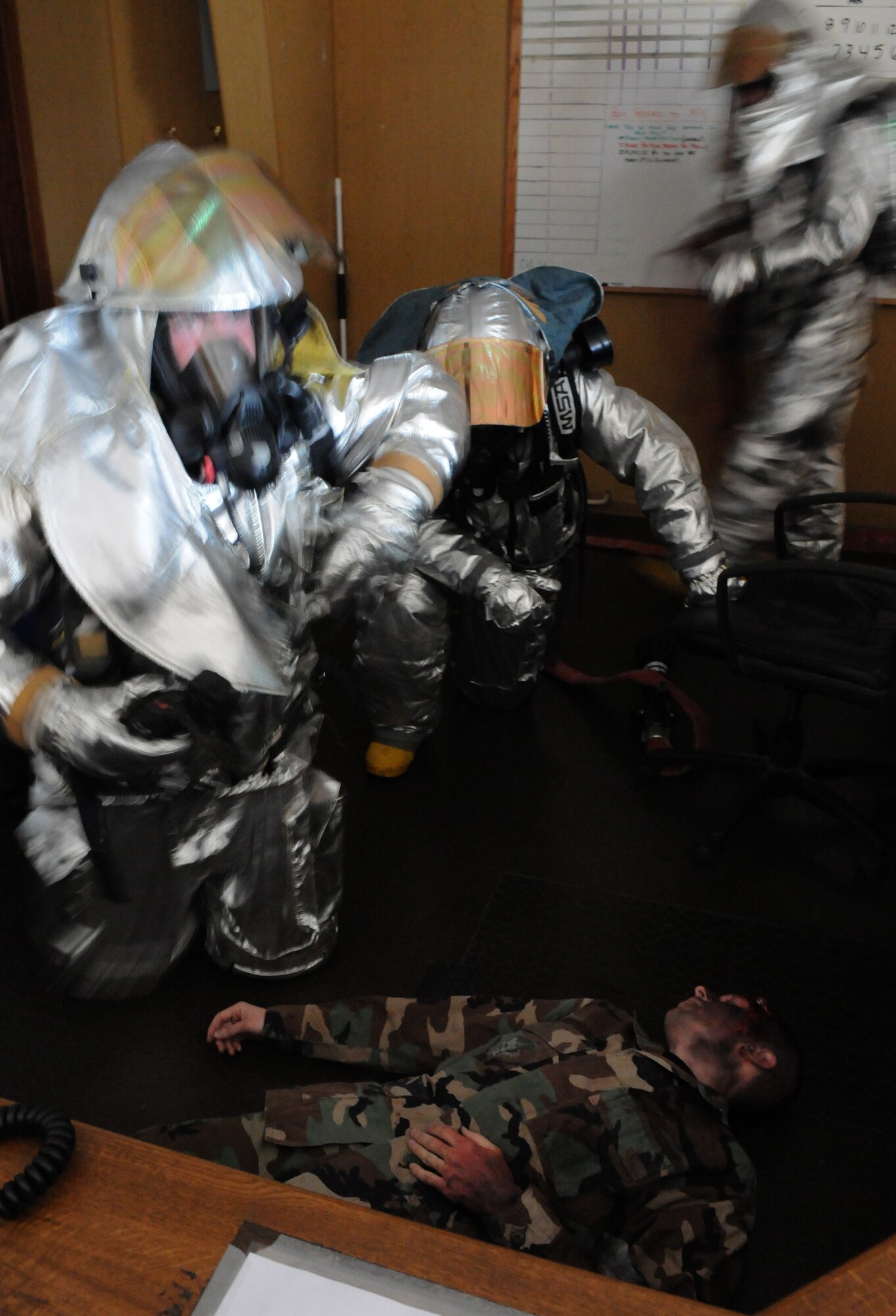 SPANGDAHLEM AIR BASE, Germany –52nd Civil Engineer Squadron firefighters rescue a simulated fire victim during Operation Saber Crown 10-04 March 2. The Phase II exercise evaluated the wing’s SABC execution, emergency response and chemical, biological, radiological, nuclear, and explosive procedures to prepare for the upcoming NATO force evaluation. (U.S. Air Force photo/Airman 1st Class Staci Miller) 