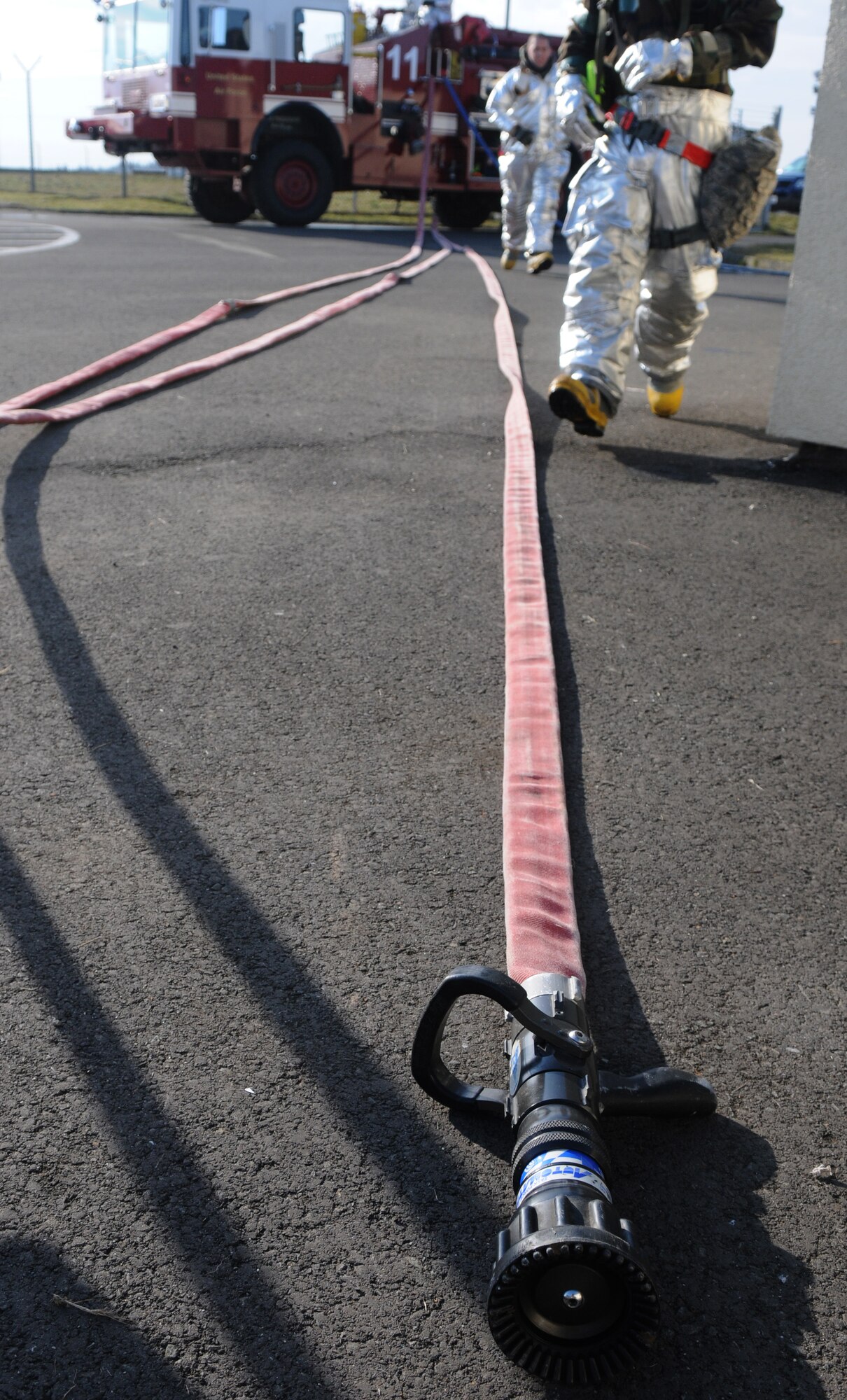 SPANGDAHLEM AIR BASE, Germany – 52nd Civil Engineer Squadron firefighters respond to a simulated fire during Operation Saber Crown 10-04 March 2. The Phase II exercise evaluated the wing’s SABC execution, emergency response and chemical, biological, radiological, nuclear, and explosive procedures to prepare for the upcoming NATO force evaluation. (U.S. Air Force photo/Airman 1st Class Staci Miller)
