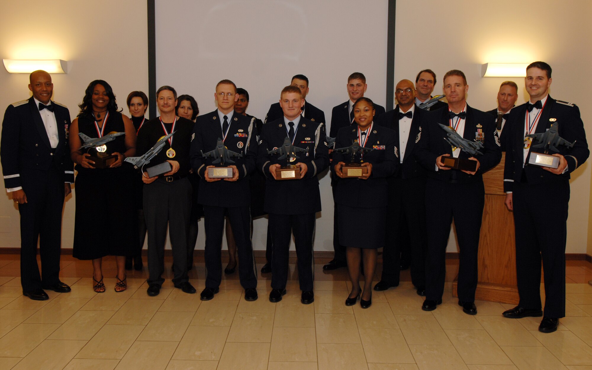 The winners of the 2009 31st Fighter Wing Annual Awards pose with wing leadership, Feb. 26 at a local Italian restaurant. More than 200 people attended the awards banquet, honoring the nominees for their hard work and service throughout 2009.  (U.S. Air Force photo/Senior Airman Taylor Marr)