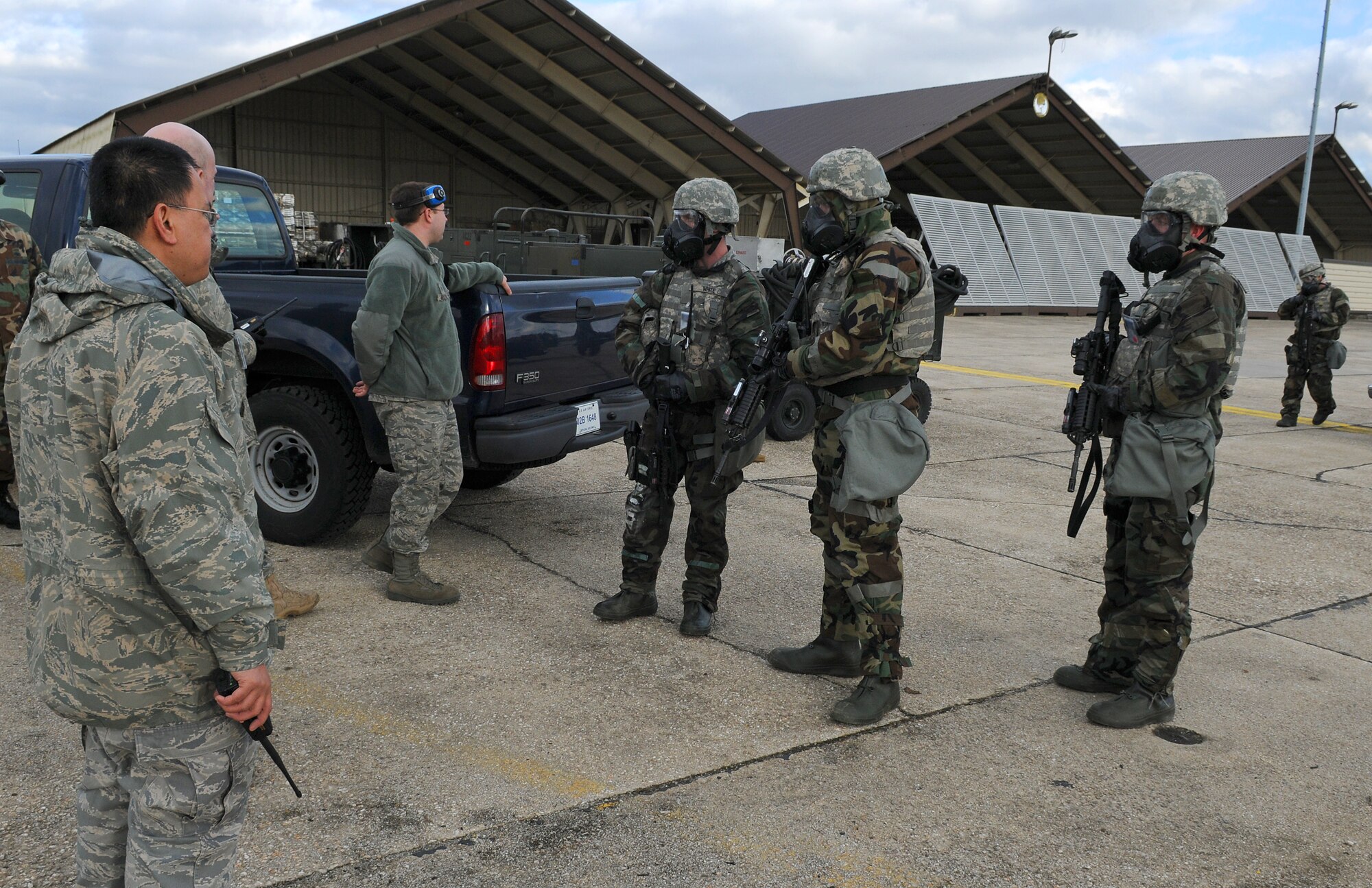 SPANGDAHLEM AIR BASE, Germany –Exercise Evaluation Team members debrief 52nd Security Forces Squadron Airmen after their response to a simulated vehicle-borne improvised explosive device during Operation Saber Crown 10-04 here March 1. The simulation tested response to the attack and wear of chemical protective gear during the Phase II exercise. (U.S. Air Force photo/Senior Airman Nathanael Callon)