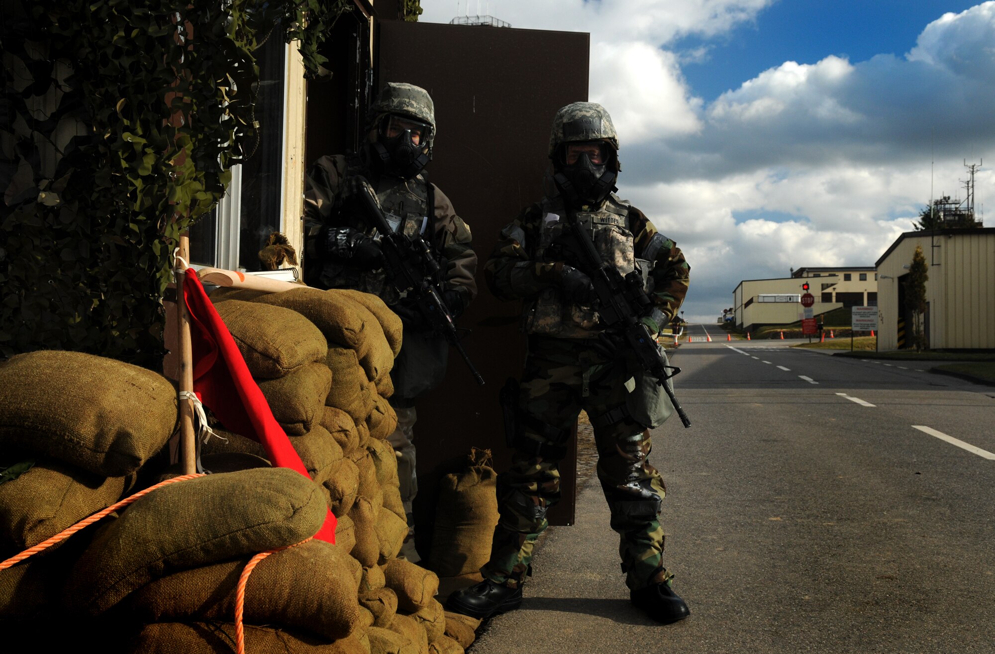 SPANGDAHLEM AIR BASE, Germany – Senior Airmen Zachriah Schlichting and Geoffrey Witter, both of the 52nd Security Forces Squadron, scan the area for possible security threats while manning the entry control point to the tactical area of responsibility during Operation Saber Crown 10-04 March 1. Members of the 52nd Fighter Wing participated in the Phase II exercise to prepare for the NATO force evaluation in June. (U.S. Air Force photo/Senior Airman Nathanael Callon)