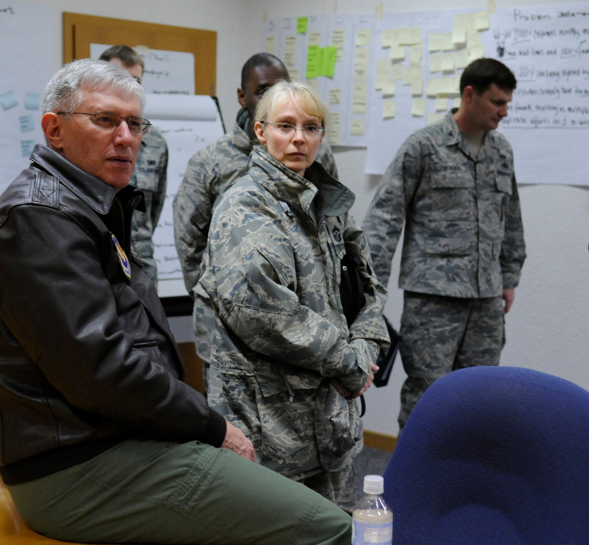 Gen. Roger A. Brady, U.S. Air Forces in Europe commander, along with Chief Master Sgt. Pamela Derrow, USAFE command chief, receives a briefing from members of the 86th Comptroller Squadron as part of his visit to the 86th Airlift Wing, March 2. The unit is currently taking part in an AFSO 21 initiative to improve their finance services across the base and throughout the Kaiserslautern Military Community.  (U.S. Air Force Photo by: Airman 1st Class Brittany Perry)