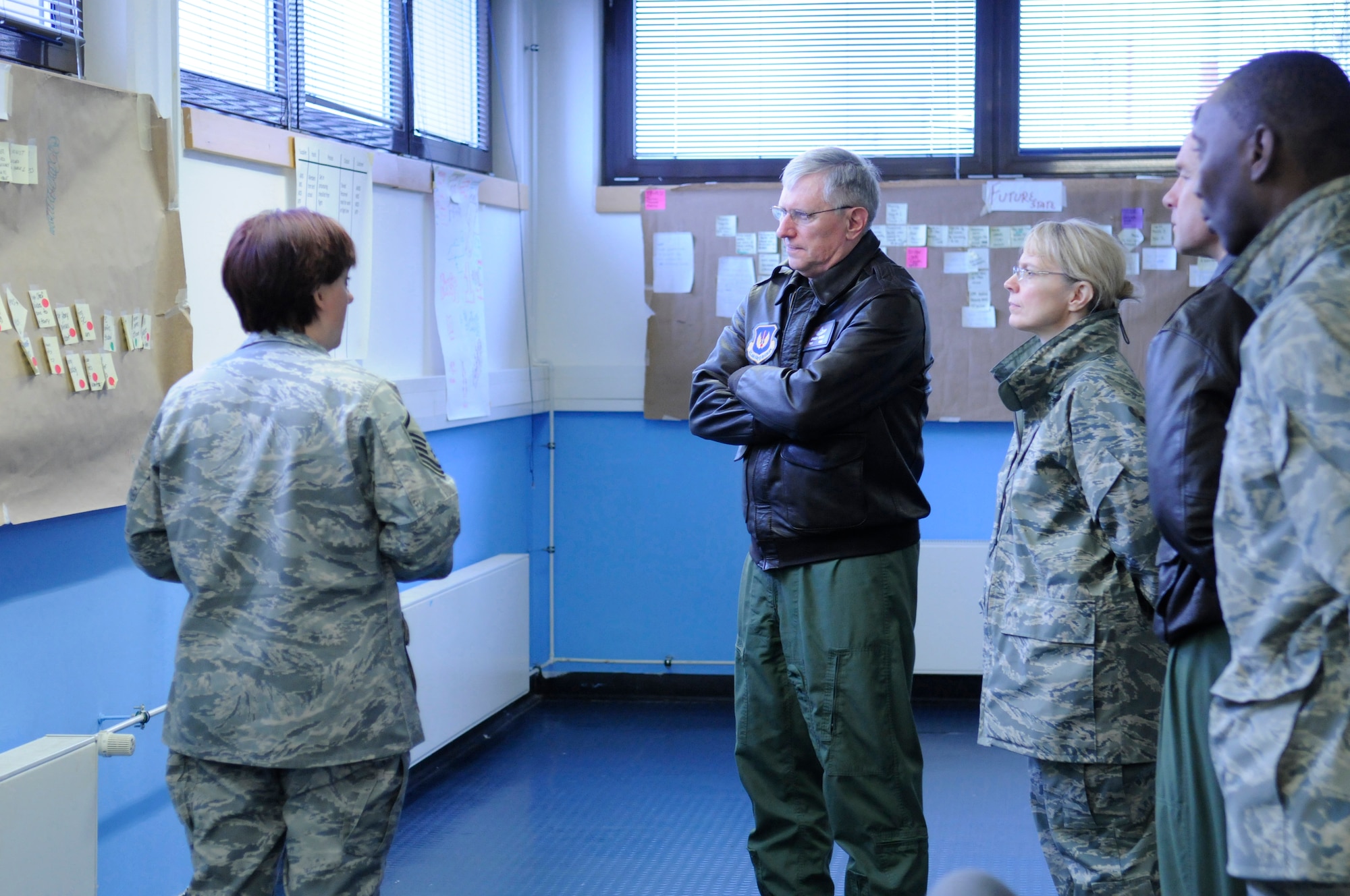 Gen. Roger A. Brady, U.S. Air Forces in Europe commander, along with Chief Master Sgt. Pamela Derrow, USAFE command chief, receives a briefing from members of the 86th Comptroller Squadron as part of his visit to the 86th Airlift Wing, March 2. The unit is currently taking part in an AFSO 21 initiative to improve their finance services across the base and throughout the Kaiserslautern Military Community.  (U.S. Air Force Photo by: Airman 1st Class Brittany Perry)