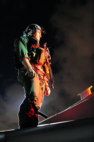 NELLIS AIR FORCE BASE, Nev. -- U.S. Navy Lt. Nathan Clayville, an electronic counter measures officer from the Tactical Electronic Warfare Squadron One Three Nine (VAQ-139) from Whidbey Island, Wash. stands on top of a EA-6B Prowler during pre-flight checks on the Nellis flightline while participating in Red Flag 10-3 Mar. 2.  Red Flag is a realistic combat training exercise involving the air forces of the United States and its allies. The exercise is conducted on the 15,000-square-mile Nevada Test and Training Range, north of Las Vegas. (U.S. Air Force photo by Tech. Sgt. Michael R. Holzworth/RELEASED)