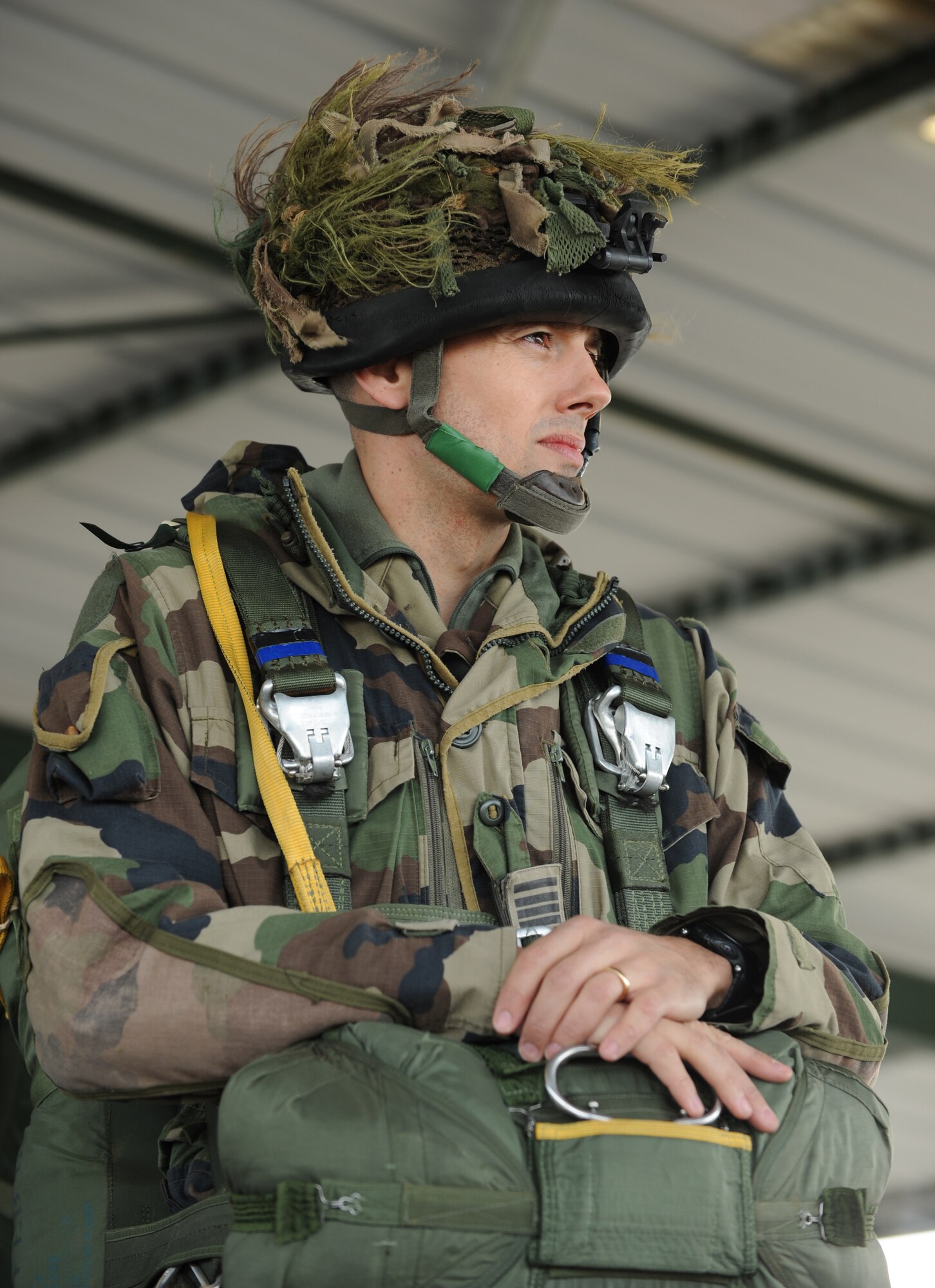 French Airborne Maj. Pierre Prod'homme, stands in wait to board a C-130J Super Hercules for a static jump at École des troupes aéroportées (ETAP) Pau, France, March 2, 2010. Members of the 435th Contingency Response Group and the 5th Quartermaster Company joined with their French military counterparts for a week of training at the École des troupes aéroportées (ETAP), or School of Airborne Troops, a military school dedicated to training the military paratroopers  the French army, located in the town of Pau, in the département of Pyrénées-Atlantiques, France.  The ETAP is responsible for training paratroopers, and for international cooperation and promotion of paratroop culture. (U.S. Air Force photo by Airman 1st Class Caleb Pierce)  