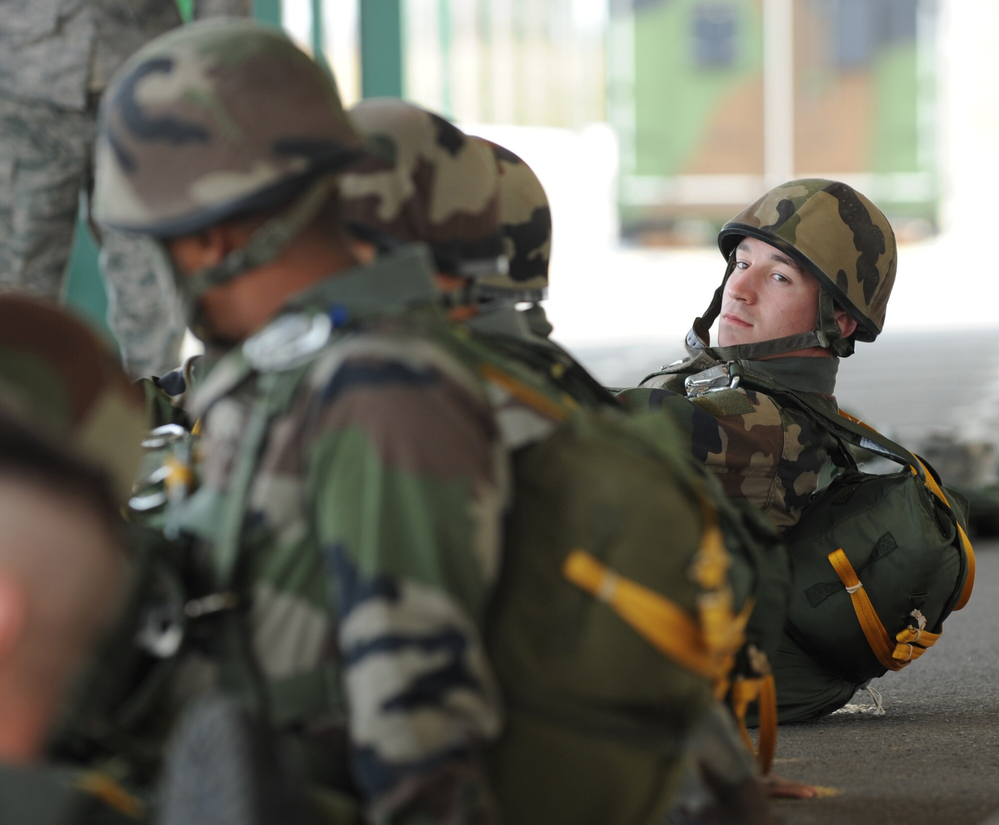 French Airborne members sit and wait to leave to a static jump from a C-130J Super Hercules at École des troupes aéroportées (ETAP) Pau, France, March 2, 2010. Members of the 435th Contingency Response Group and the 5th Quartermaster Company joined with their French military counterparts for a week of training at the École des troupes aéroportées (ETAP), or School of Airborne Troops, a military school dedicated to training the military paratroopers  the French army, located in the town of Pau, in the département of Pyrénées-Atlantiques, France.  The ETAP is responsible for training paratroopers, and for international cooperation and promotion of paratroop culture. (U.S. Air Force photo by Airman 1st Class Caleb Pierce)