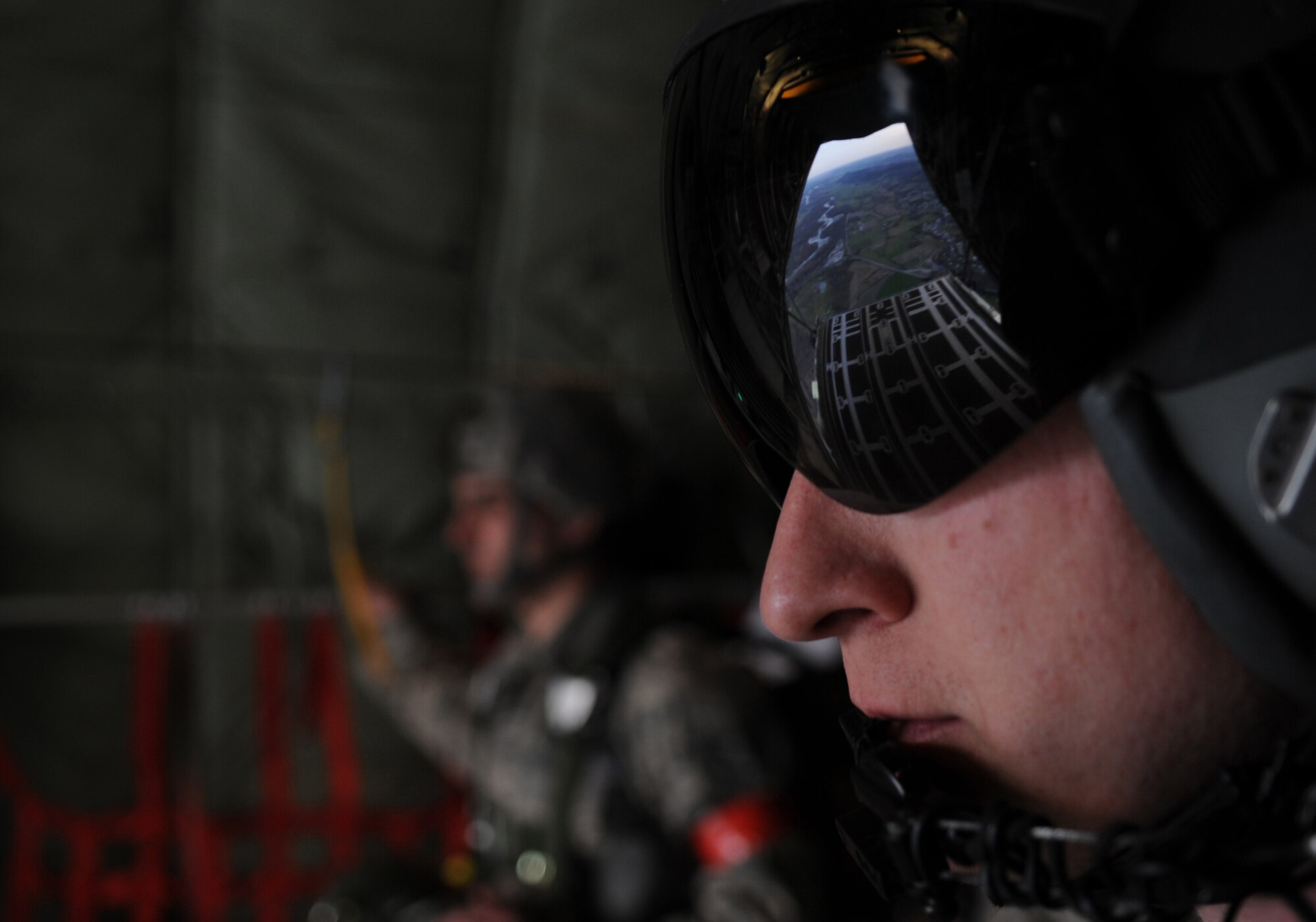 U.S. Air Force Staff Sgt. Scott Broughton, 37th Airlift Squadron crew chief, watches out the back of a C-130J Super Hercules waiting for airborne members to do a static jump at École des troupes aéroportées (ETAP) Pau, France, March 2, 2010. Members of the 435th Contingency Response Group and the 5th Quartermaster Company joined with their French military counterparts for a week of training at the École des troupes aéroportées (ETAP), or School of Airborne Troops, a military school dedicated to training the military paratroopers  the French army, located in the town of Pau, in the département of Pyrénées-Atlantiques, France.  The ETAP is responsible for training paratroopers, and for international cooperation and promotion of paratroop culture. (U.S. Air Force photo by Airman 1st Class Caleb Pierce)