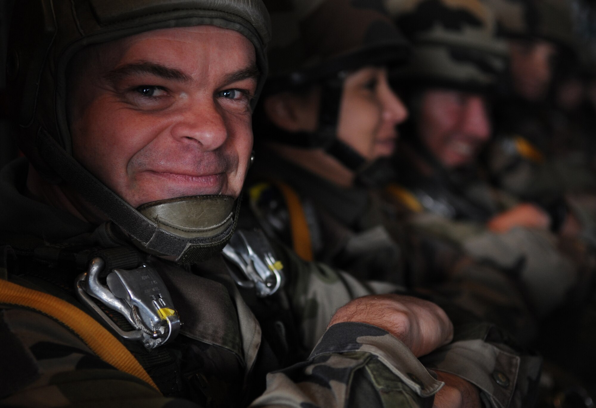 French Marine Maj. Yann Le Bastard, free fall instructor at École des troupes aéroportées (ETAP), poses for a photo prior to a static jump from a C-130J Super Hercules at École des troupes aéroportées (ETAP) Pau, France, March 2, 2010. Members of the 435th Contingency Response Group and the 5th Quartermaster Company joined with their French military counterparts for a week of training at the École des troupes aéroportées (ETAP), or School of Airborne Troops, a military school dedicated to training the military paratroopers  the French army, located in the town of Pau, in the département of Pyrénées-Atlantiques, France.  The ETAP is responsible for training paratroopers, and for international cooperation and promotion of paratroop culture. (U.S. Air Force photo by Airman 1st Class Caleb Pierce)