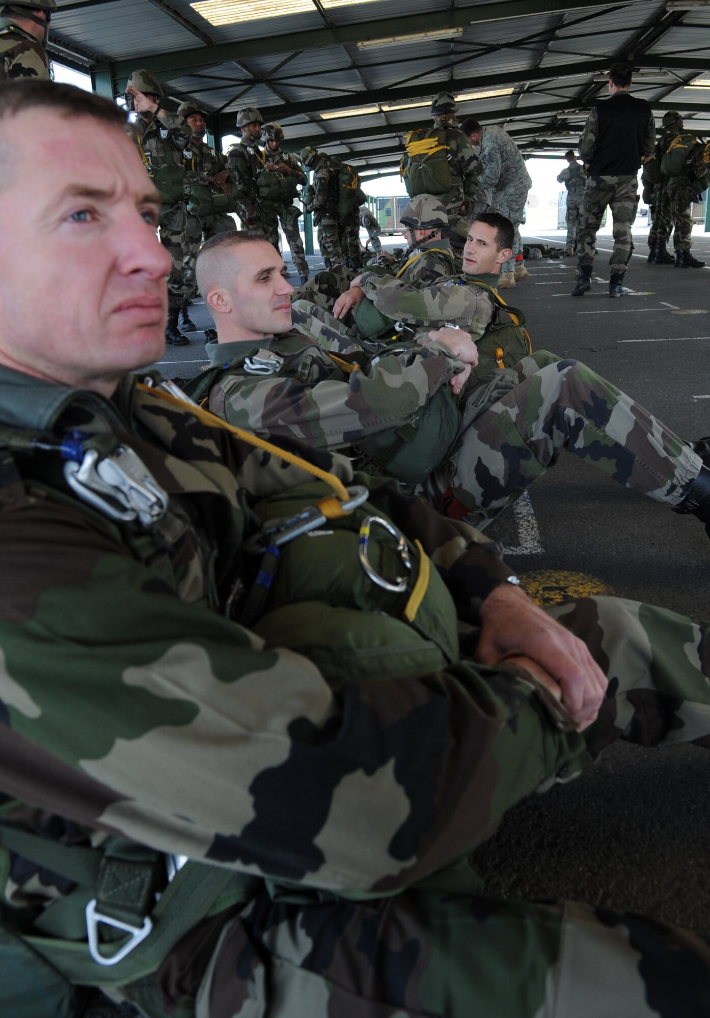 French Airborne members sit and wait to leave to a static jump from a C-130J Super Hercules at École des troupes aéroportées (ETAP) Pau, France, March 2, 2010. Members of the 435th Contingency Response Group and the 5th Quartermaster Company joined with their French military counterparts for a week of training at the École des troupes aéroportées (ETAP), or School of Airborne Troops, a military school dedicated to training the military paratroopers  the French army, located in the town of Pau, in the département of Pyrénées-Atlantiques, France.  The ETAP is responsible for training paratroopers, and for international cooperation and promotion of paratroop culture. (U.S. Air Force photo by Airman 1st Class Caleb Pierce)