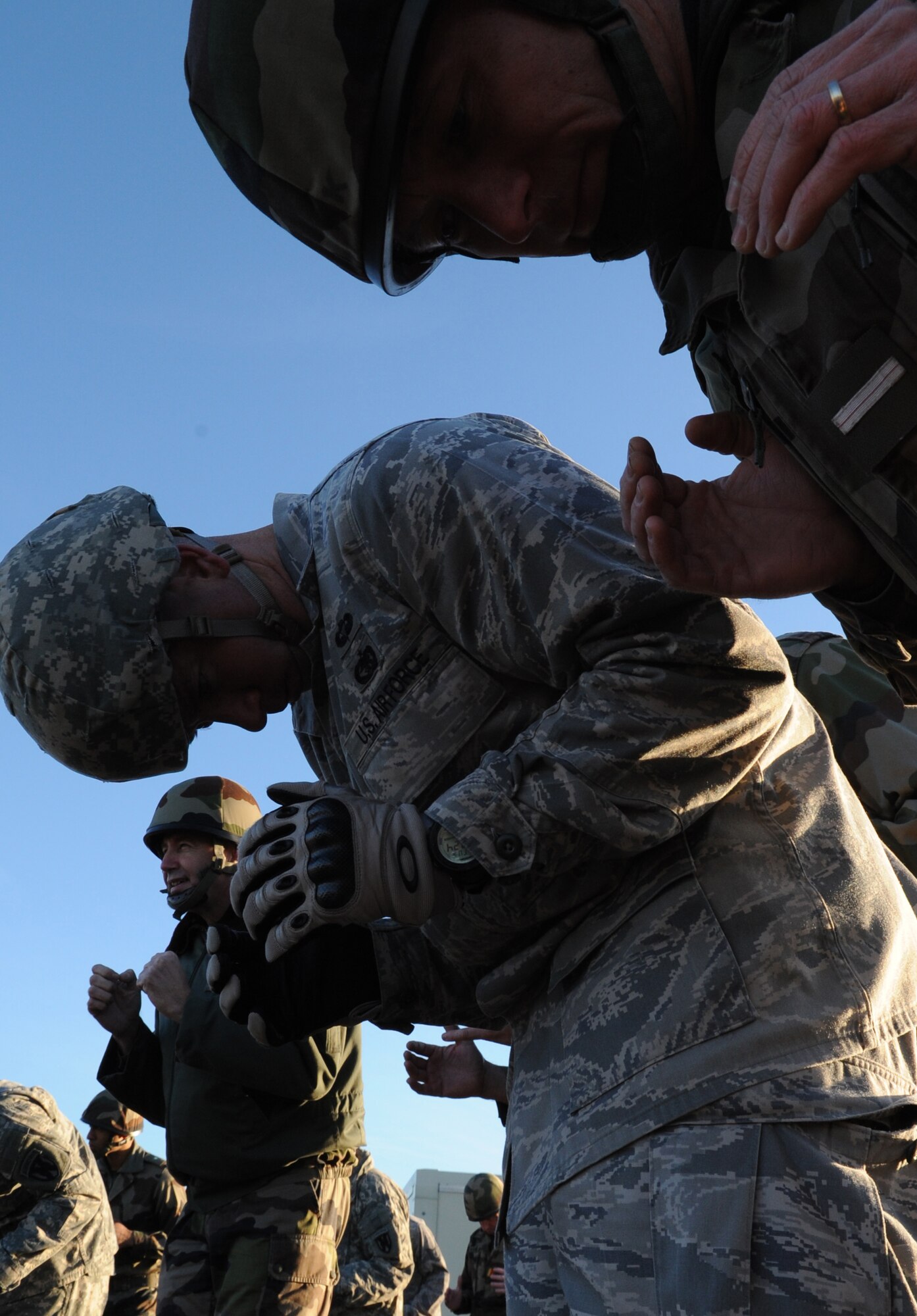 Airborne members from the 435th Contingency Response Group and the 5th Quartermaster Company participate in pre-jump training for a static jump from a C-130J Super Hercules with the French Airborne military at École des troupes aéroportées (ETAP) Pau, France, March 2, 2010. Members of the 435th Contingency Response Group and the 5th Quartermaster Company joined with their French military counterparts for a week of training at the École des troupes aéroportées (ETAP), or School of Airborne Troops, a military school dedicated to training the military paratroopers  the French army, located in the town of Pau, in the département of Pyrénées-Atlantiques, France. The ETAP is responsible for training paratroopers, and for international cooperation and promotion of paratroop culture. (U.S. Air Force photo by Airman 1st Class Caleb Pierce)