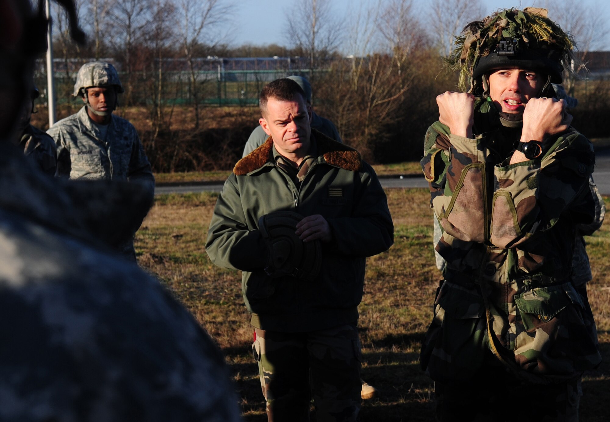 French Marine Major Pierre Prod'homme a freefall instructor provides translation and instruction from U.S. military personnel to French military paratroops on proper use and procedure for jumping with U.S. equipment from U.S. aircraft.  Members of the 435th Contingency Response Group and the 5th Quartermaster Company joined with their French military counterparts for a week of training at the École des troupes aéroportées (ETAP), or School of Airborne Troops, a military school dedicated to training the military paratroopers   of the French army, located in the town of Pau, in the département of Pyrénées-Atlantiques, France.  The ETAP is responsible for training paratroopers, and for international cooperation and promotion of paratroop culture. (U.S. Air Force Photo by Staff Sgt. Jocelyn Rich) 