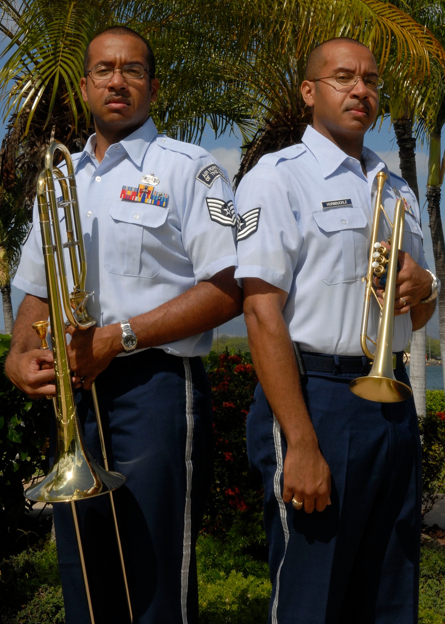 Tech. Sgt. Brian Hornbuckle and his identical twin brother Tech. Sgt. Michael Hornbuckle joined the Air Force together as bandsmen. Sergeant Brian Hornbuckle is a trumpet player and Sergeant Michael Hornbuckle is a trombone player with the Band of the Pacific at Hickam Air Force Base, Hawaii. (U.S. Air Force photo/Tech. Sgt Jerome S. Tayborn)