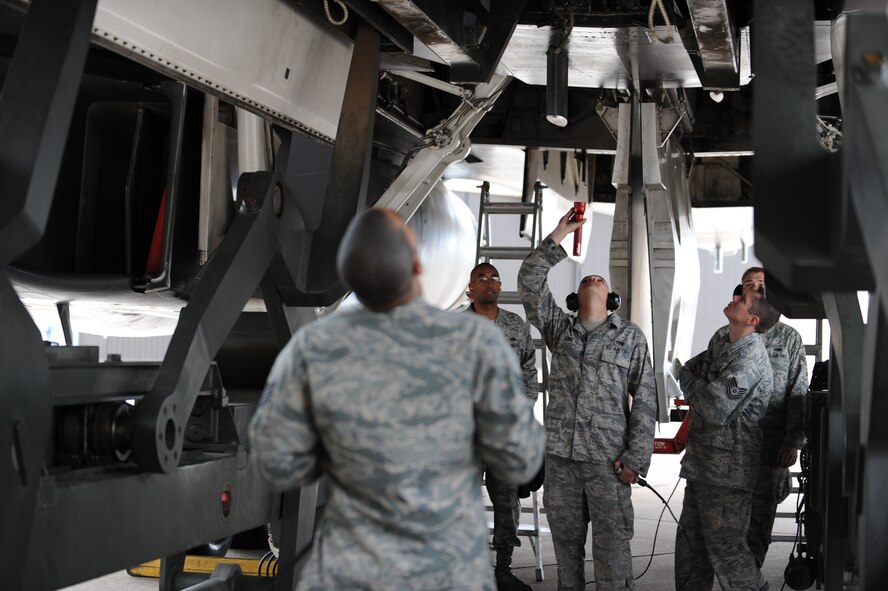 DYESS AIR FORCE BASE, Texas – Airman First Class Stephen Lebel, a weapons load crew member from the 7th Aircraft Maintenance Squadron, verifies the proper installment of the weapon during a load crew competition here, March 5. A load crew competition not only challenges the load crews to have the fastest time, but also requires that they have a safe load with no safety write-ups. (U.S. Air Force photo/ Airman 1st Class Brittney Prescott)