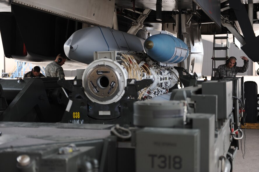 DYESS AIR FORCE BASE, Texas – Airman 1st Class Stephen Lebel , a weapons load crew member from the 7th Aircraft Maintenance Squadron, helps his fellow Airmen direct the weapons into the aircraft weapons bay here, March 5. Airmen from the 7th AMXS are participating in a load crew competition that challenged them to load weapons into the aircraft safely and efficiently with the fastest time. (U.S. Air Force photo/Airman First Class Brittney Prescott)