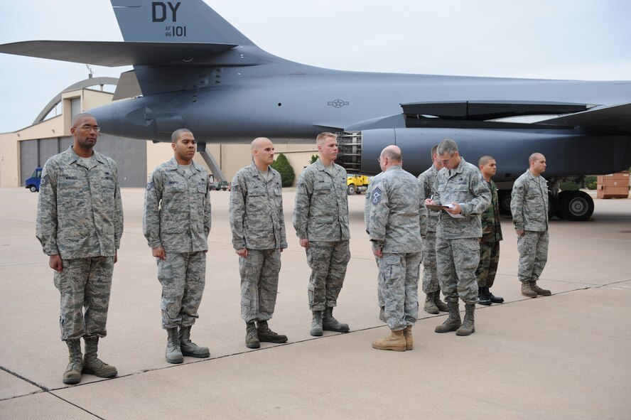 DYESS AIR FORCE BASE, Texas –Chief Master Sgt. David Goldie, 7th Bomb Wing Command Chief, performs an open ranks inspection on the weapons load crew before the load crew competition begins here, March 5. The load crew competition is a timed weapons load based on safety and efficiency. (U.S. Air Force photo/ Airman 1st Class Brittney Prescott)