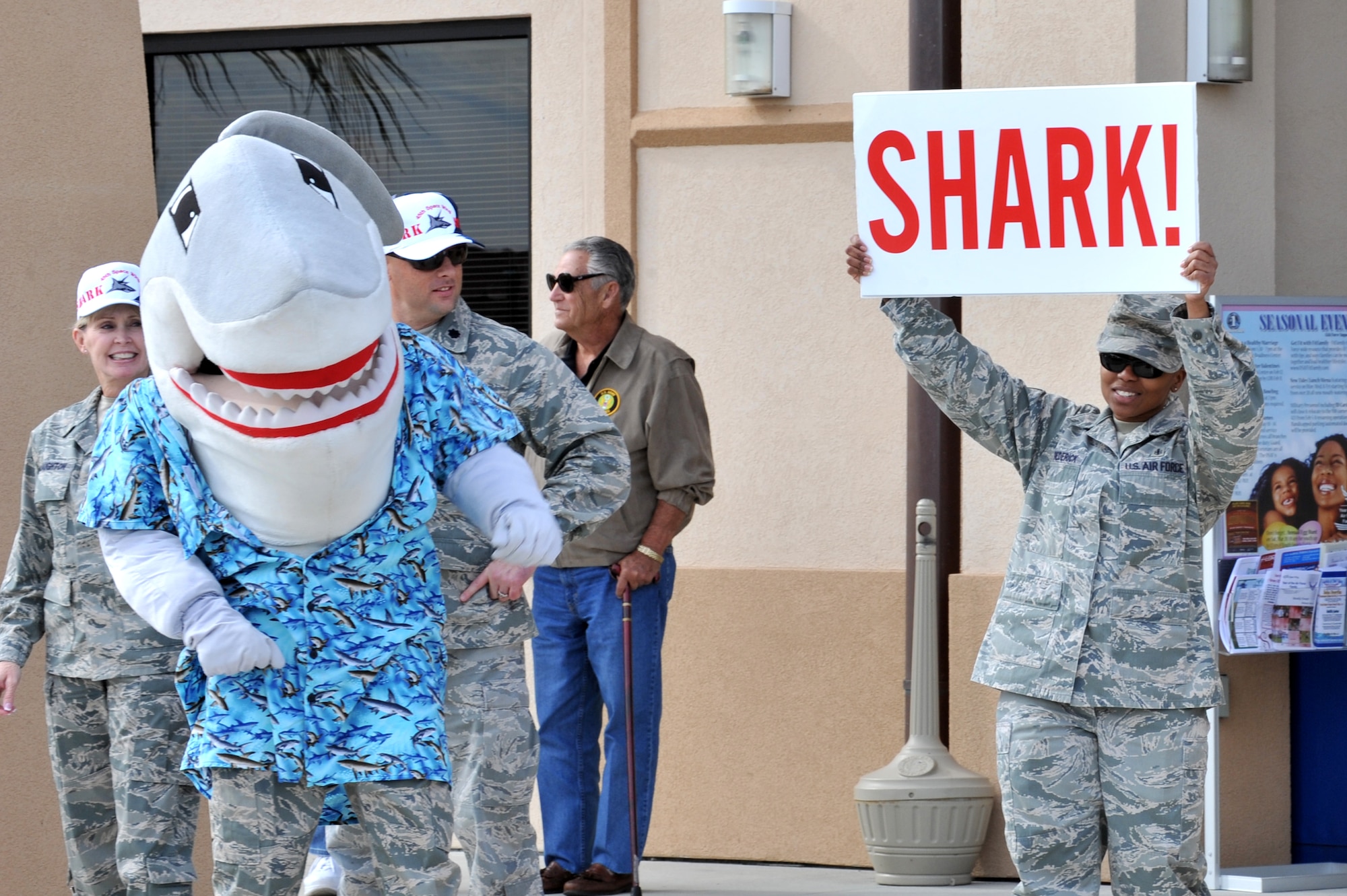 Snark the Shark leads the 45 Space Wing in a SHARK ATTACK cheer.   