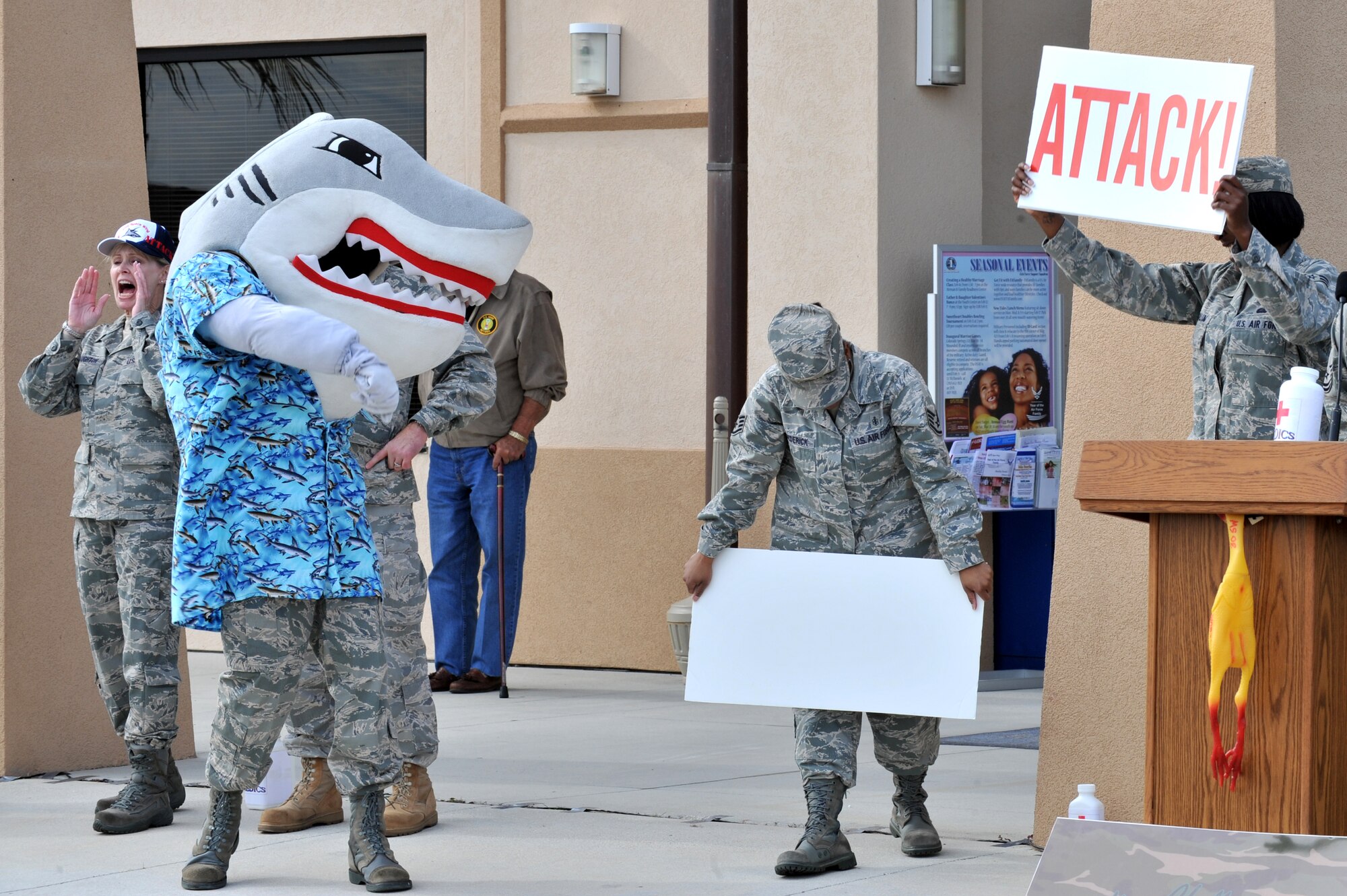 Snark the Shark leads the 45 Space Wing in a SHARK ATTACK cheer.   