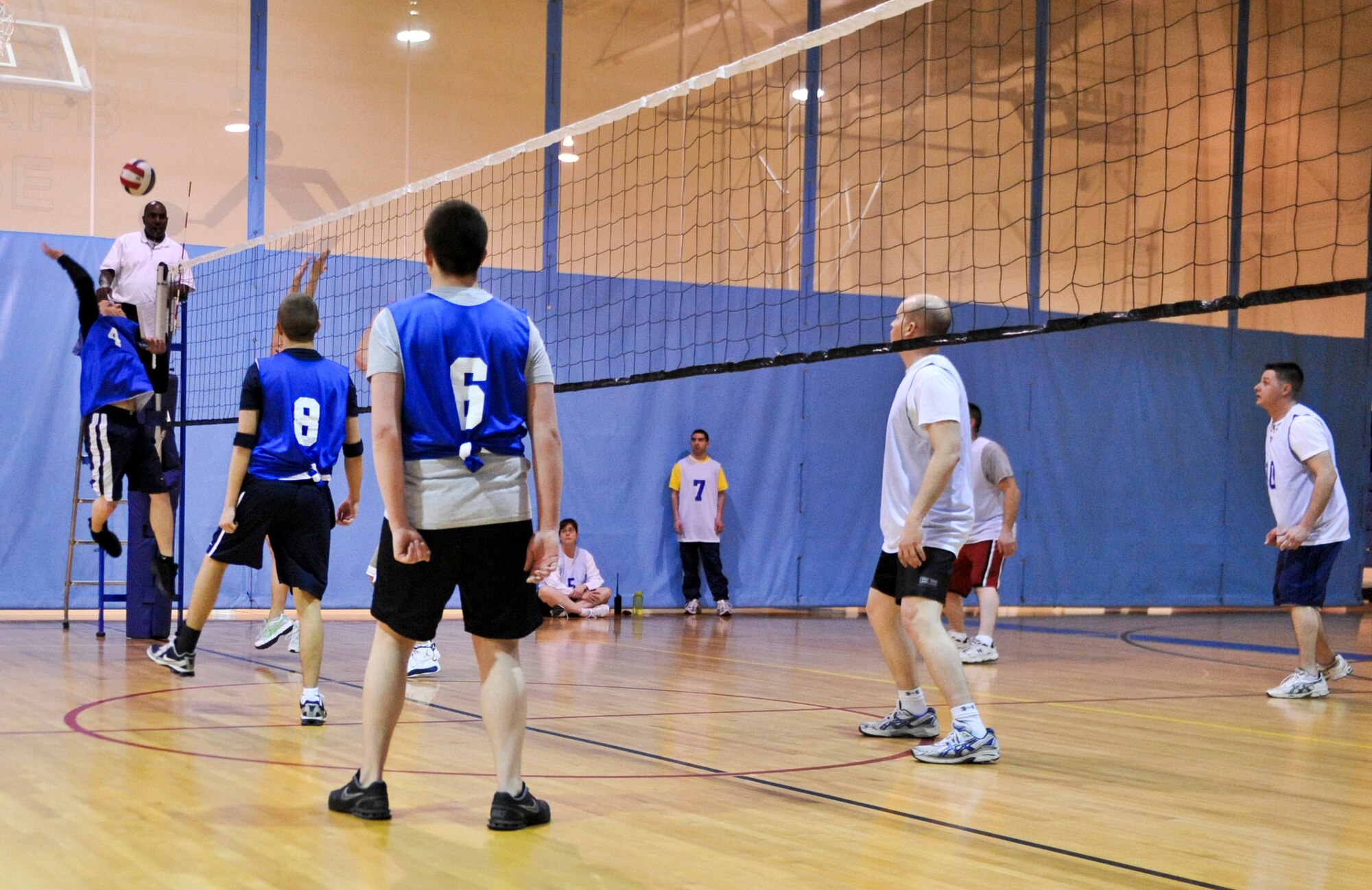 ELMENDORF AIR FORCE BASE, Alaska – A member from the 3rd Security Forces Squadron reaches back to hit the ball back to the 732nd Air Mobility Squadron, during a game March 3, at Elmendorf’s Fitness Center. The 732nd AMS won two straight sets, with a score of 25-18 and 25-14, to win the matchup between the two teams during intramural play. (Air Force photo by Airman 1st Class Christopher Gross)