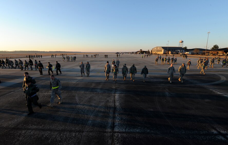MOODY AIR FORCE BASE, Ga. -- Airmen thoroughly inspect the flightline during a foreign object debris walk before the upcoming Phase I Operational Readiness Inspection here March 5. Airmen searched for loose rubble, trash, gravel and other materials that do not belong on the flightline. (U.S. Air Force photo by Airman 1st Class Benjamin Wiseman)