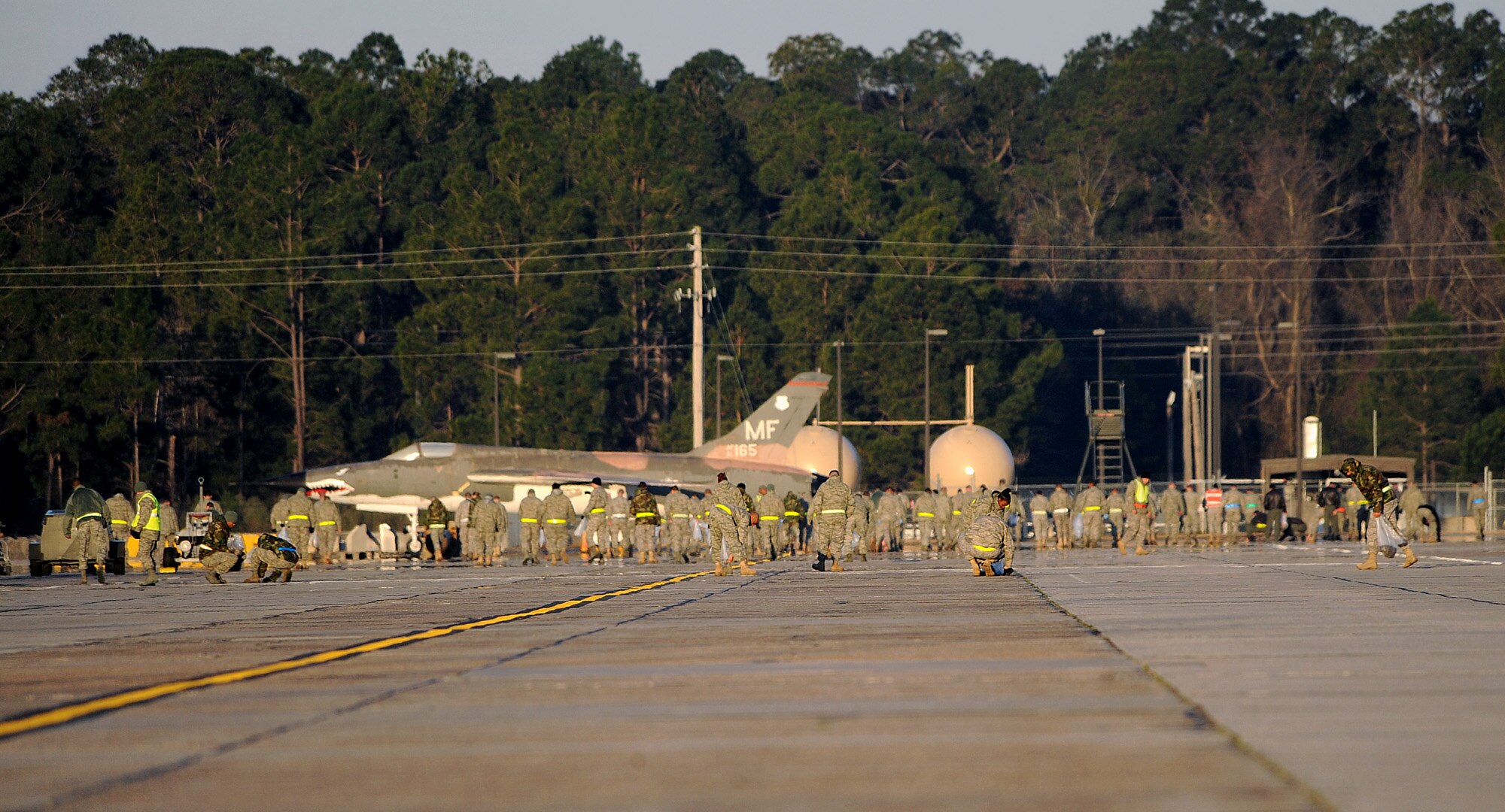 MOODY AIR FORCE BASE, Ga. -- Airmen at Moody participate in a foreign object debris walk in preparation for the upcoming Phase I Operational Readiness Inspection here March 5. The purpose of the FOD walk is to take preventative steps to remove objects such as loose gravel, metal, trash or rocks that could cause damage to any aircraft, from the flightline. (U.S. Air Force photo by Airman 1st Class Joshua Green)  
