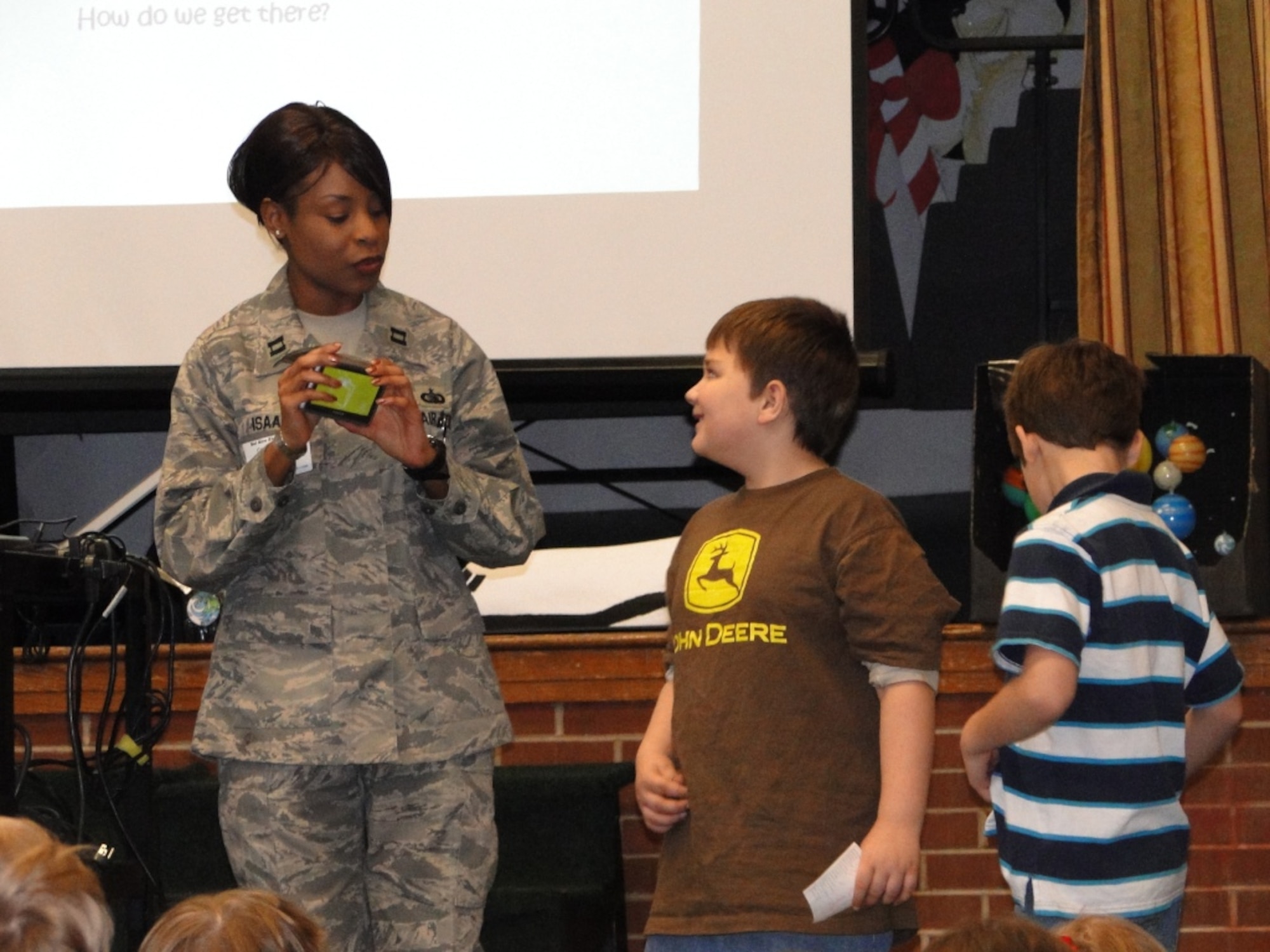 Capt. Catercia Isaac talks to Bel-Aire Elementary students about how AEDC has tested the Global Positioning Satellite (GPS). To demonstrate the GPS, the captain showed them a GPS unit used in many vehicles. (Photo provided)