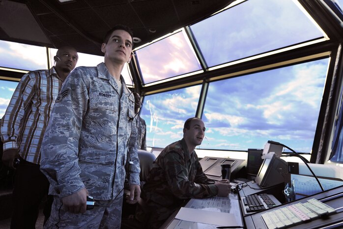NELLIS AIR FORCE BASE, Nev. --  Senior Airman Kirk Robert, Aaron Headen and Staff Sgt. Steven Williams, air traffic controllers assigned to the 57th Operations Support Squadron oversee the safe, orderly and expeditious launch and recovery of 70 military aircraft during Red Flag 10-3, on March 5, 2010.  The aircraft fly north of Las Vegas to train on the 15,000-square-mile Nevada Test and Training Range. (U.S. Air Force photo by Lawrence Crespo/RELEASED)