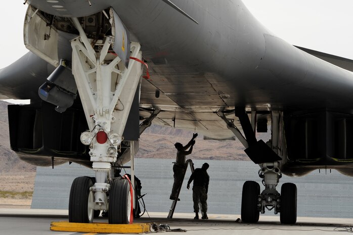 NELLIS AIR FORCE BASE, Nev. --  Crew chiefs assigned to the 7th Aircraft Maintenance Squadron, perform a post flight inspection on a B-1 bomber during Red Flag 10-3, February 26, 2010.  Red Flag is a realistic combat training exercise involving the United States Air Force and its allies. The exercise is conducted on the 15,000-square-mile Nevada Test and Training Range, north of Las Vegas. (U.S. Air Force photo by Lawrence Crespo/RELEASED)