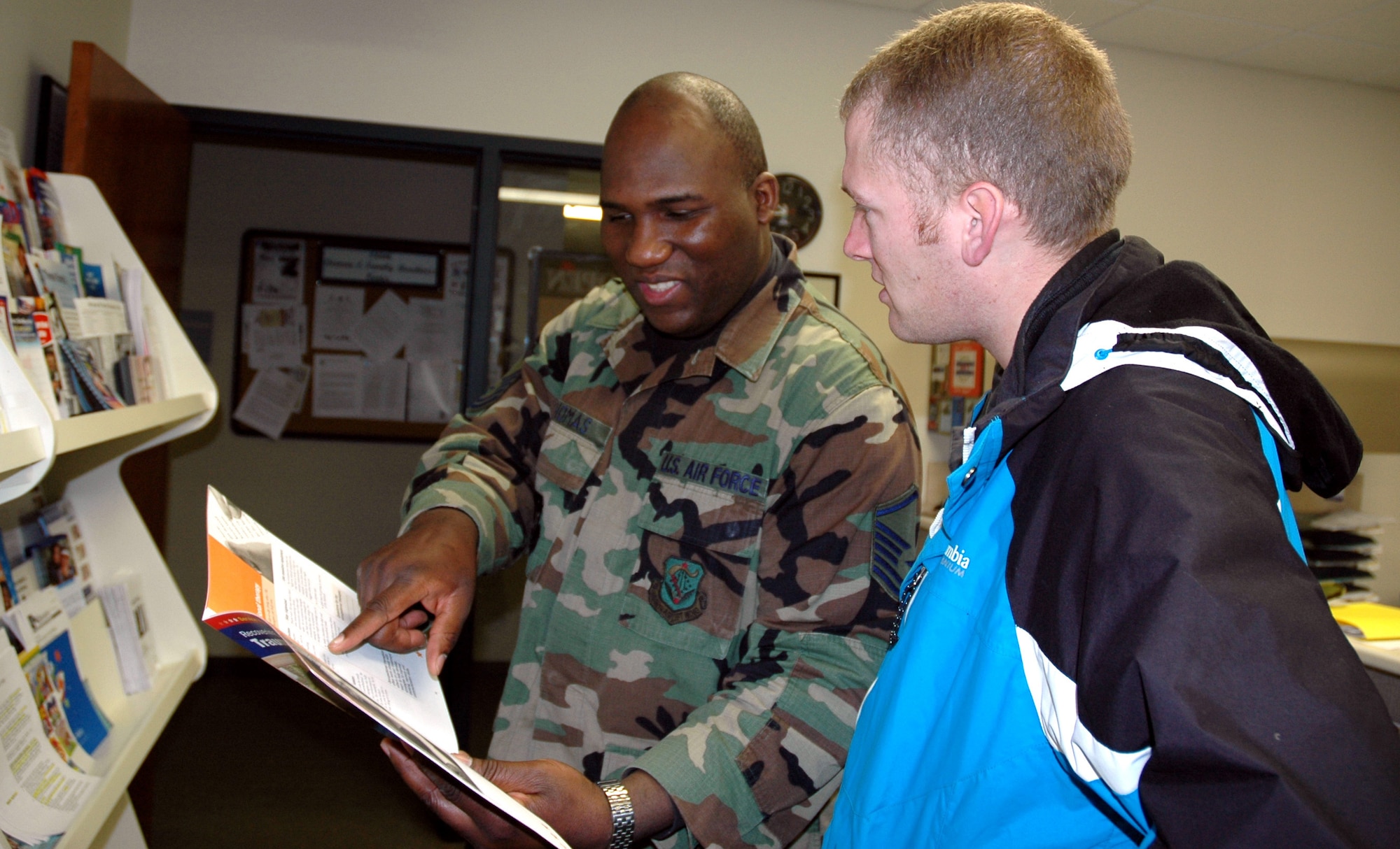 JOINT BASE LEWIS-MCCHORD, Wash. - Master Sgt. Steven Thomas, NCO in charge of the 446th Mission Support Squadron Airman & Family Readiness Center here (left), helps Tech. Sgt. Ian Ramos, 446th Logistics Readiness Flight, find information on budgeting and financial management, March 5. The center provides long-term, substantive programs to positively affect those areas of family life that directly impact the Air Force mission. The A&FRC provides programs, workshops and services to suit the needs of every Reservist, whether single, married, deployed, with kids or a civilan job. (U.S. Air Force photo/Staff Sgt. Nicole Celestine)