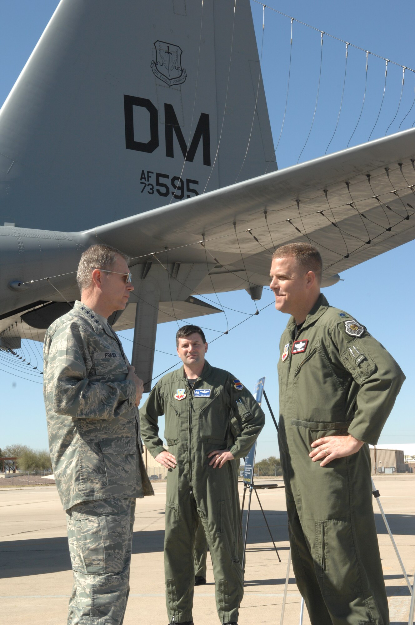 Gen. William M. Fraser III speaks to Lt. Col. Marty Reynolds (center), and Lt. Col. Bob Stonemark (right) on the flightline during his tour of Davis-Monthan Air Force Base, Feb. 23, 2010. General Fraser is the commander of Air Combat Command. Colonel Reynolds is the 42nd Electronic Combat Squadron commander. Colonel Stonemark is the 43rd Electronic Combat Squadron commander. (U.S. Air Force photo/Staff Sgt. Alesia Goosic)