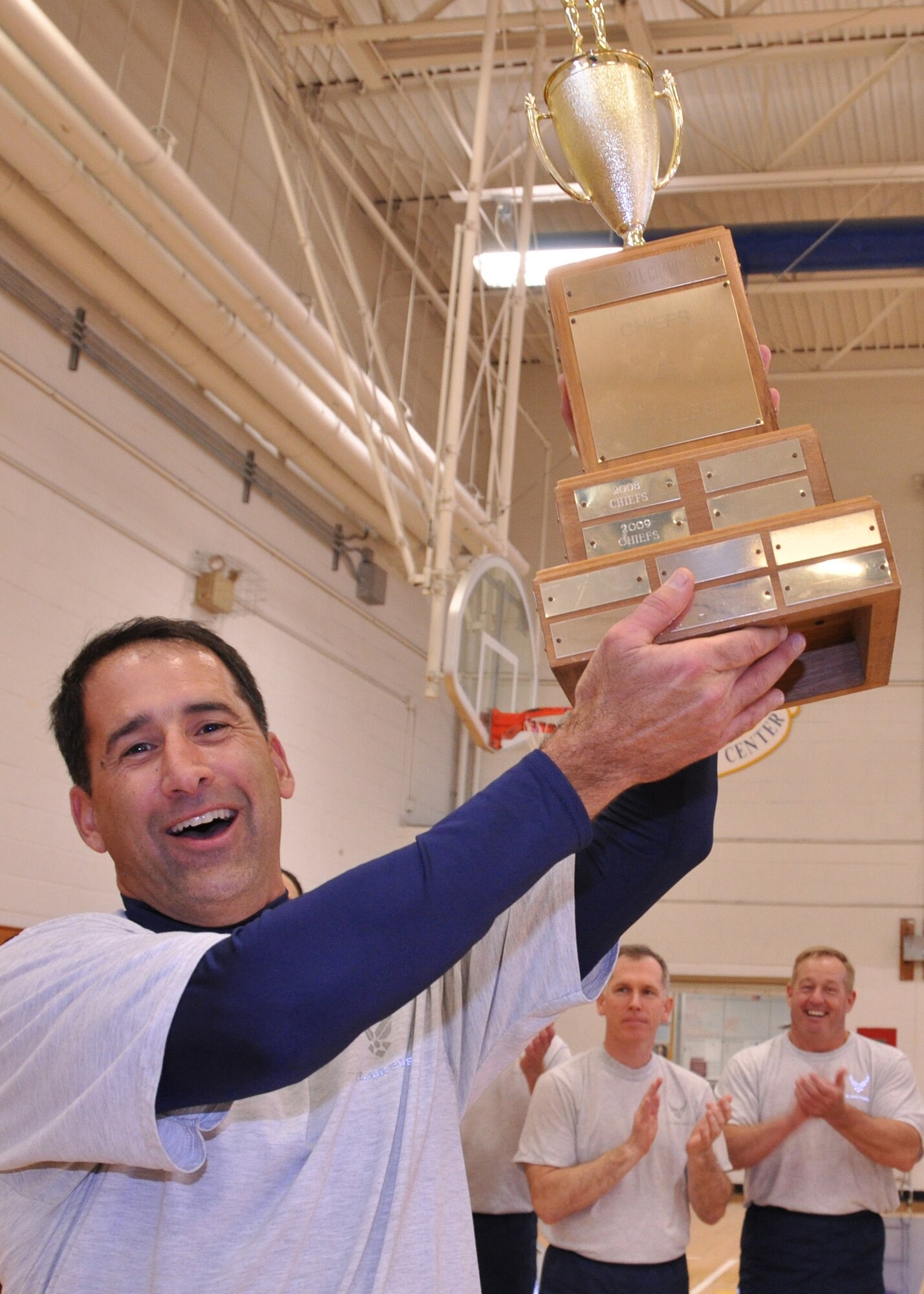 EGLIN AIR FORCE BASE, Fla. – Col. Michael Guidry, Air Armament Center safety, holds up the Eagles’ trophy after the first game of the 3rd Annual Chiefs vs. Eagles Multi-Sport Tournament March 4, at the Eglin Fitness Center. The tournament pits Eglin’s chief master sergeants against colonels in volleyball, softball, golf and basketball. The Eagles won 3-0 in the best-of-five volleyball match. Their next matchup is a softball game, April 30. (U.S. Air Force photo/ Airman 1st Class Anthony Jennings)
