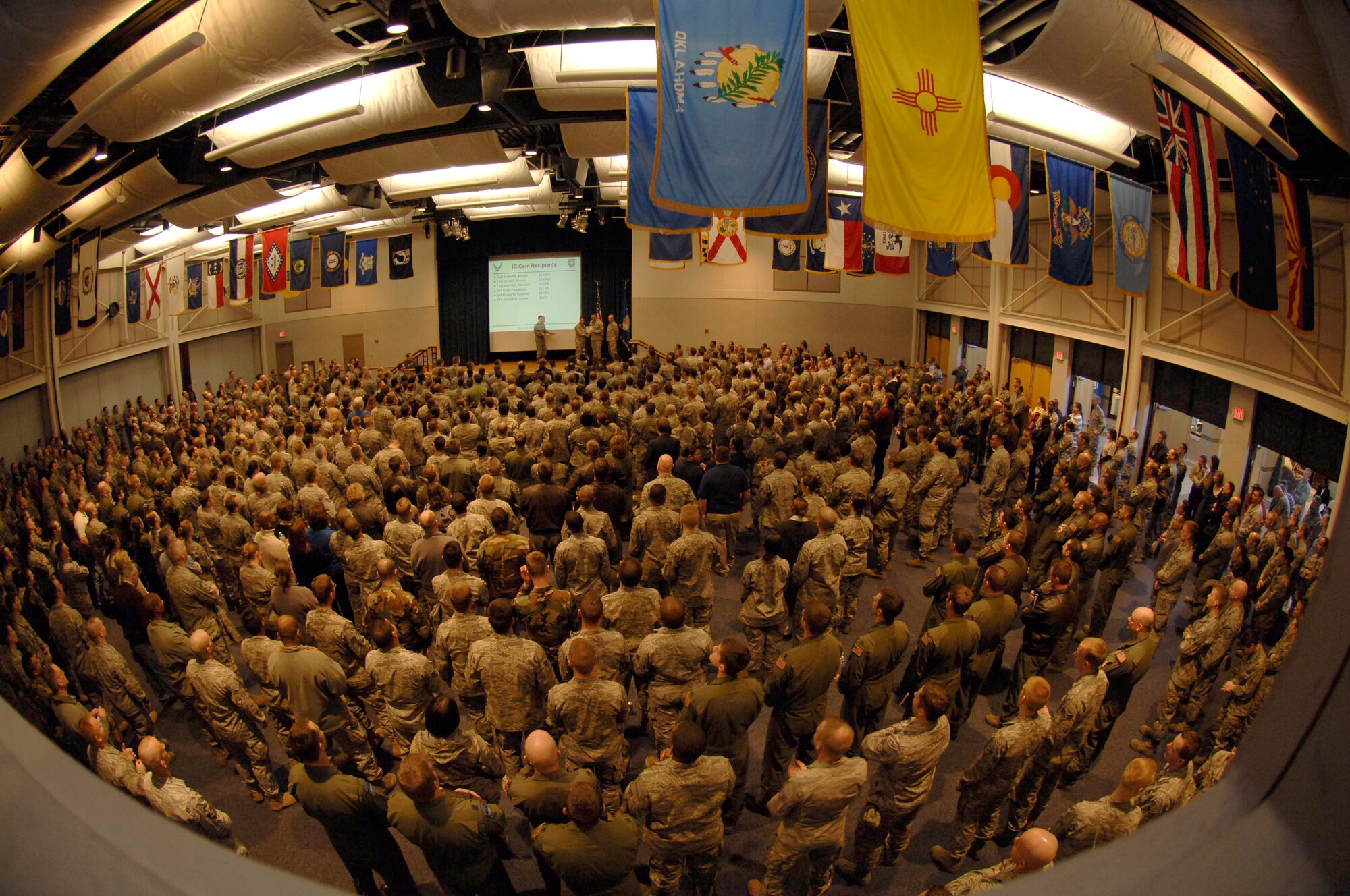 Members of McConnell Air Force Base, listen as Col. James Crowhurst, 22nd Air Refueling Wing commander, speaks about the results of each group from a unit compliance inspection at the Robert J. Dole Center ballroom, March 2. During the UCI, inspectors from Air Mobility Command evaluated McConnell’s work centers to ensure they are compliant with Air Force regulations. (U.S. Air Force Photo/Senior Airman Abigail Klein)