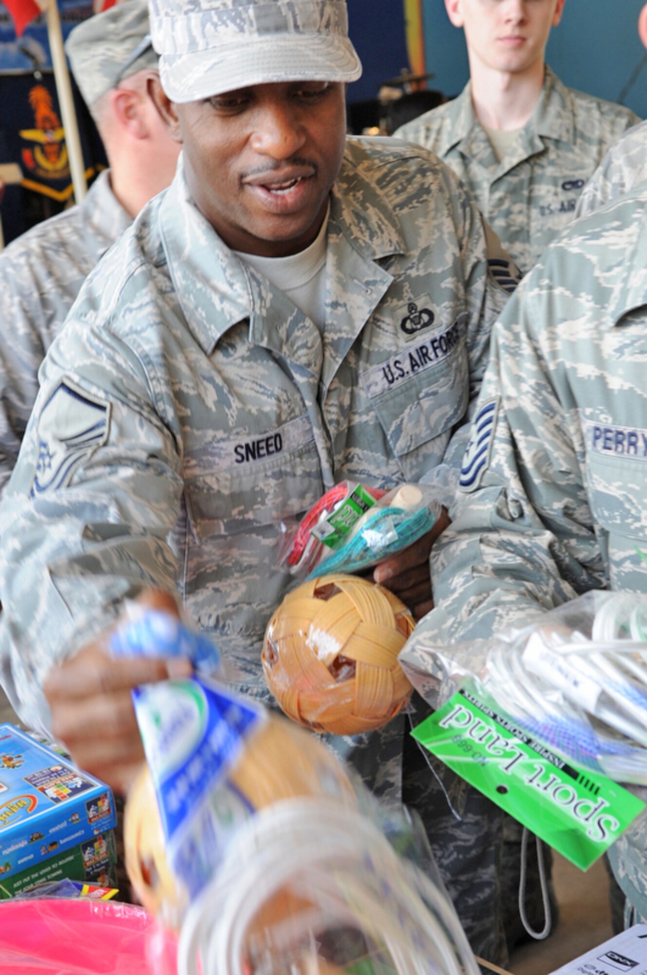 Master Sgt. Ray Sneed drops off toys for donation during a Cope Tiger 2010 community relations event March 4, 2010, at Bau Nong Sroung School in Thailand. Sergeant Sneed is deployed from the 15th Operations Support Squadron at Joint Base Pearl Harbor-Hickam, Hawaii. (U.S. Air Force photo/Tech. Sgt. Cohen A. Young)