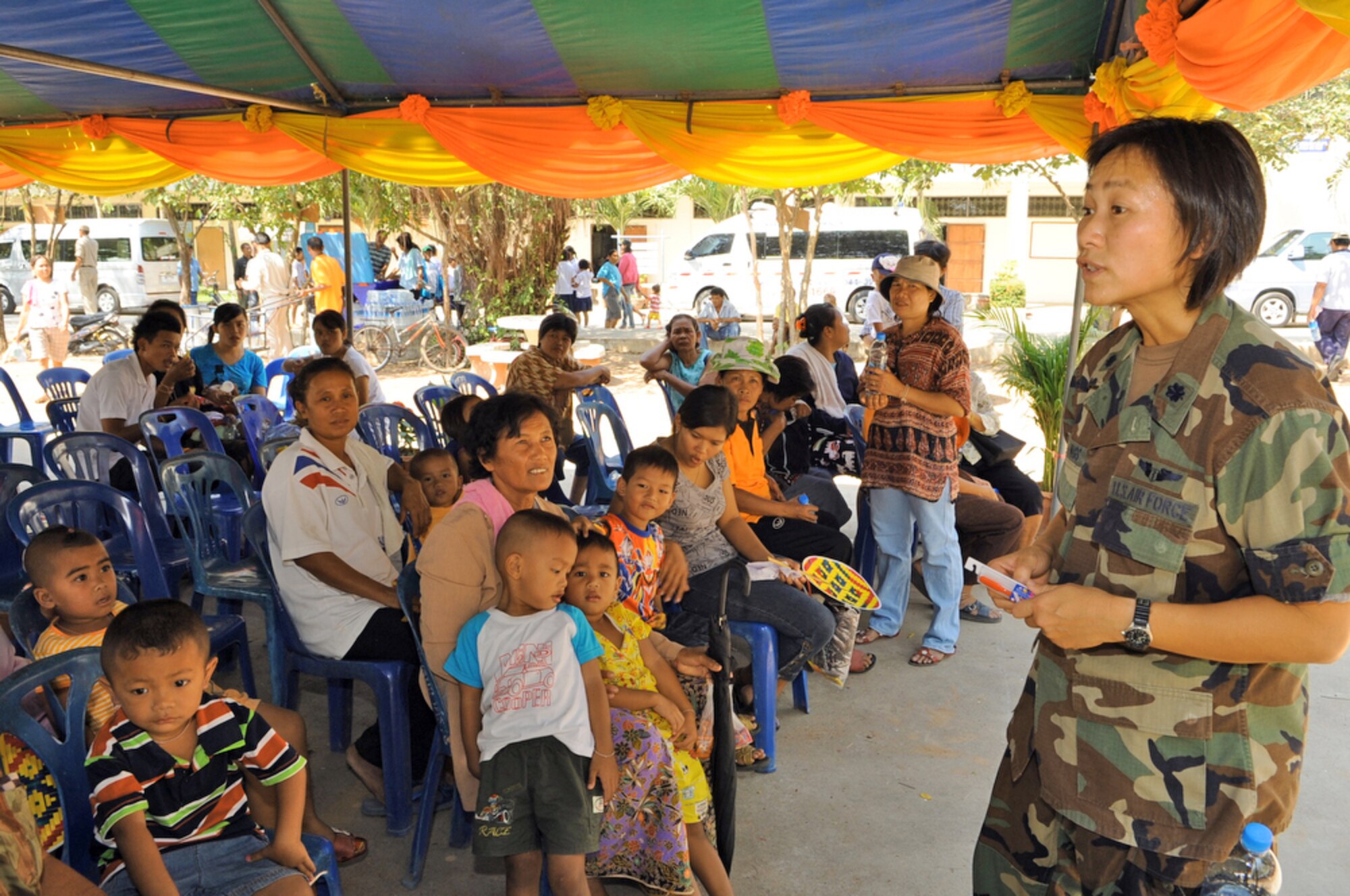 Lt. Col. Peerach Ewings talks to local women and children about the importance of proper dental health and controlling their diet March 4, 2010, at Bau Nong Sroung School in Thailand. Colonel Ewings is deployed from the 13th Air Force at Joint Base Pearl Harbor-Hickam, Hawaii. (U.S. Air Force photo/Tech. Sgt. Cohen A. Young)