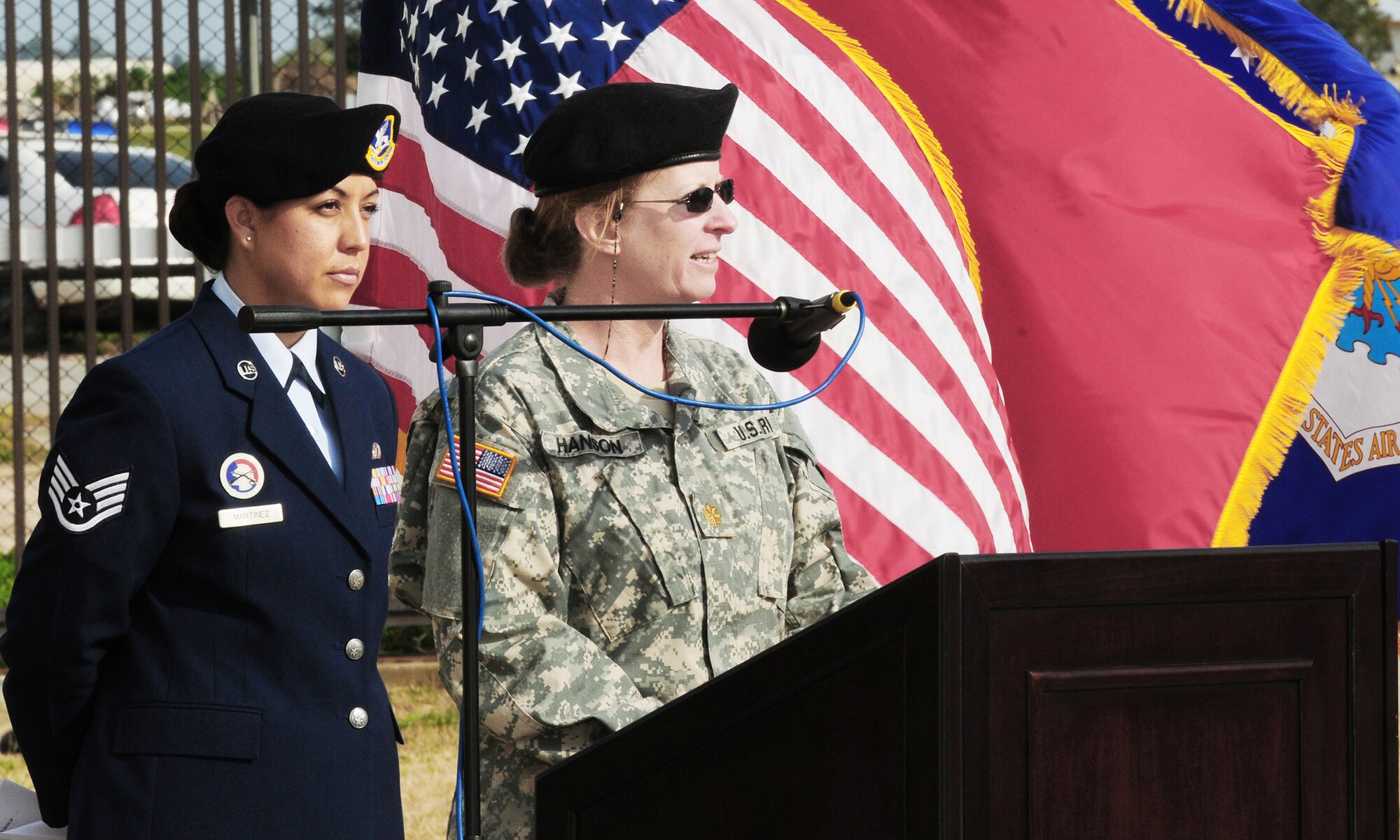 Maj. Katheryn Hanson speaks to memorial service attendees about her experiences with Ronnie, a fallen 39th Security Forces Squadron military working dog Feb. 25, 2010, at Incirlik Air Base, Turkey. Major Hanson is a veterinarian assigned to the 39th Medical Group. (U.S. Air Force photo/Senior Airman Alex Martinez)