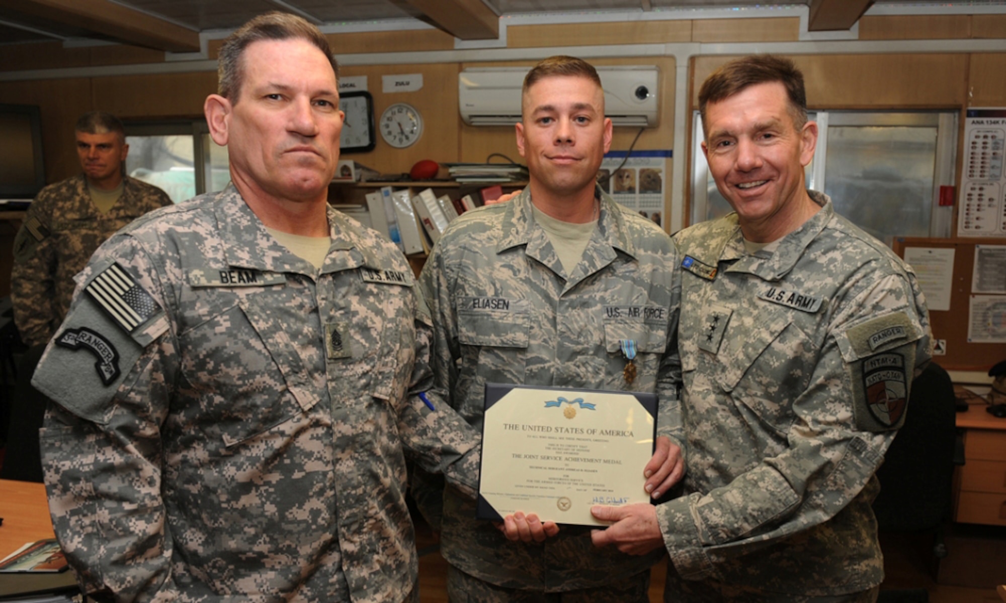 KABUL, Afghanistan - U.S. Air Force Tech. Sgt. Andreas Eliasen, center, is presented the Joint Service Achievement Medal, from U.S. Army Lt. Gen. William B. Caldwell IV, right,  commander NATO Training Mission Afghanistan and Command Sergeant Maj. Ralph Beam at Camp Eggers, Afghanistan Feb. 24, 2010. Sergeant Eliasen received the Joint Service Achievement Medal for his work performance at Camp Eggers. The medal is presented as the Unsung Hero award at Camp Eggers for U.S.military personnel. It's called the Unsung Hero award, because some military personnel aren't always in the view of higher leadership and don't have the opportunity to get recognized for their accomplishments. (U.S. Air Force photo by Senior Airman Brian Ybarbo/RELEASED)