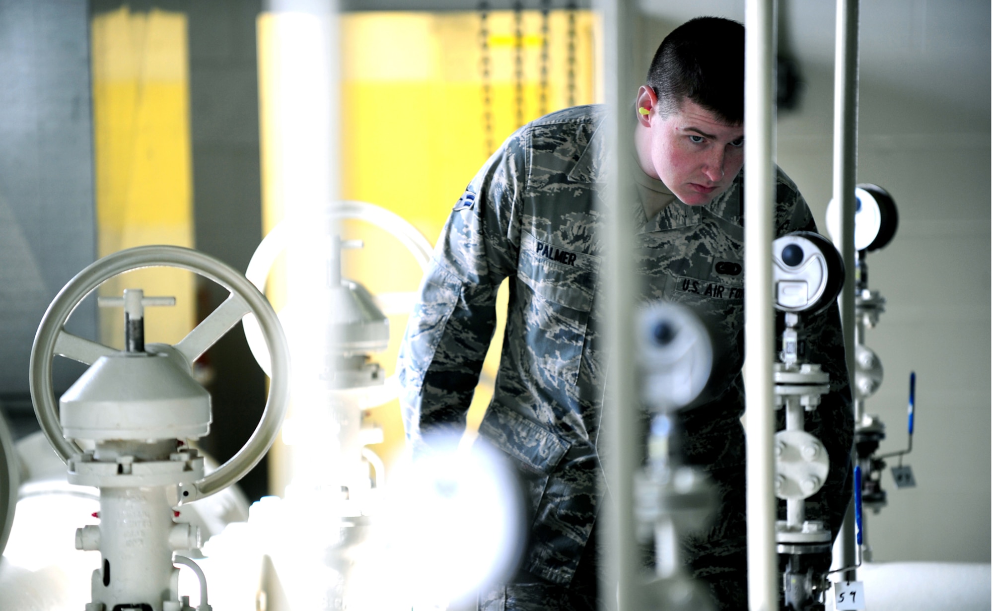 OFFUTT AIR FORCE BASE, Neb. ? Airman 1st Class Robert Palmer, a fuels distribution operator with the 55th Maintenance Squadron?s Fuels Management Flight, conducts a daily inspection of the main pump house used to maintain constant fuel pressure in Offutt's underground fuel delivery system March 2. U.S. Air Force photo by Josh Plueger
