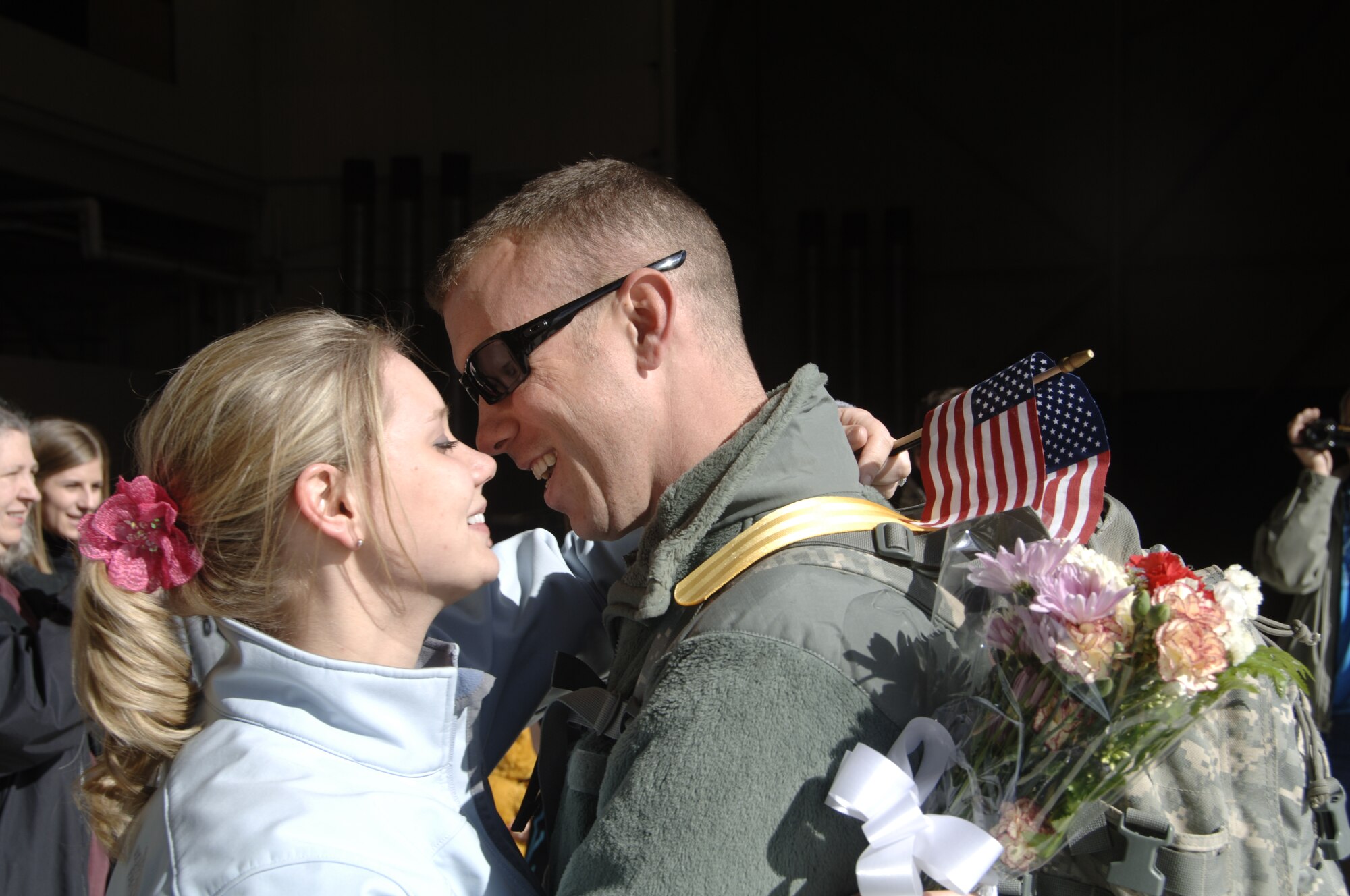 FAIRCHILD AIR FORCE BASE, Wash.--Staff Sgt. Lonnie Bell, and his wife Amy, reunite on the flightline after a six-month deployment to Iraq, Feb. 25. (U.S. Air Force photo / SSgt Chad Watkins)