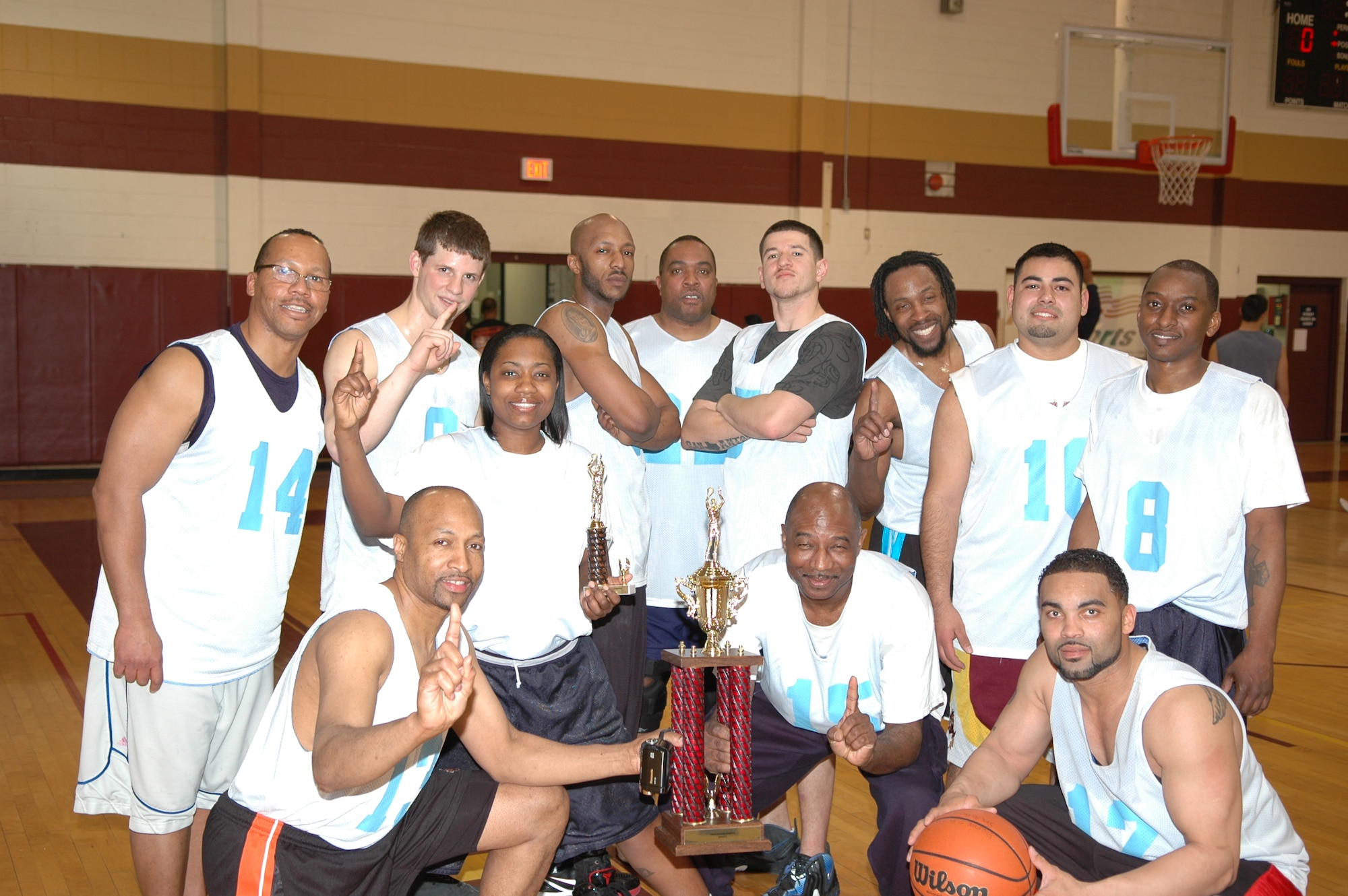 The No. 1 ranked and undefeated Flight Controller team took hone the intramural basketball championship trophy after defeating the Navy’s SCW-1 team 43-30 on March 1. (Air Force photo by Brandice J. Armstrong)