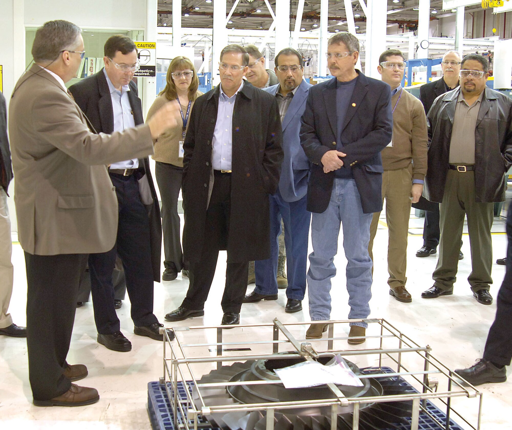 Leaders from Air Force Materiel Command’s unions and civil service converged at Tinker last week for an American Federation of Government Employees Partnership Council meeting and updates on Tinker’s production work. Tours included the newest facility, Bldg. 9001 and various shops in Bldg. 3001. Tinker’s Jimmie Green, 544th Propulsion Maintenance Squadron, left, takes the group through the F119 area in Bldg. 3001. Visitors shown include, from left ; Dr. Steve Butler, AFMC executive director, Wright-Patterson AFB, Ohio; Thomas Berard, executive director of Air Force Flight Test Center at Edwards AFB, Calif.; Charlie Tripis, vice president, AFGE Council 214 at Warner Robins AFB, Ga.; Scott Blanch, president, AFGE Council 214 at Hill AFB, Utah; James Schmidt, president, AFGE Local 916 at Tinker and George Amaya, president, AFGE Local 1406 at Edwards. (Air Force photo by Margo Wright)