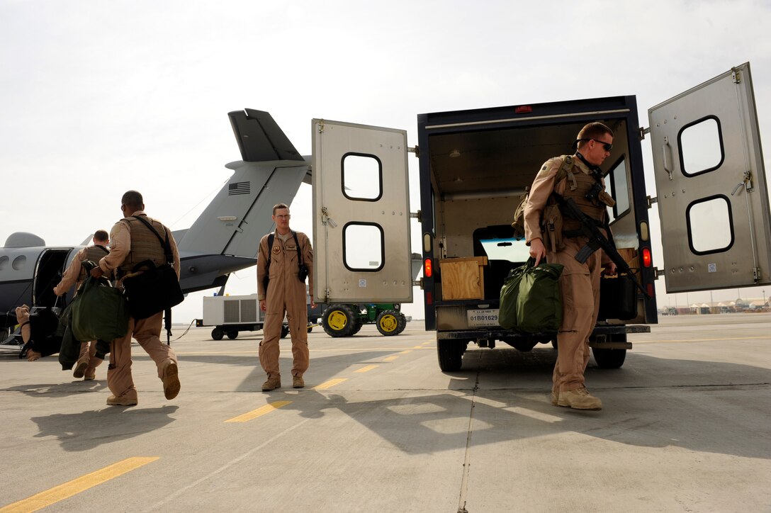 An MC-12W Liberty aircrew assigned to the 4th Expeditionary Reconnaissance Squadron, prepares to board an MC-12W for a mission Feb. 27, 2010, at Bagram Airfield, Afghanistan.  Since the 4th Expeditionary Reconnaissance squadron stood up in December 2009, the all-volunteer unit known as the ?Crows? has flown 130 sorties, logging more than 600 hours.  (U.S. Air Force photo/Staff Sgt. Manuel J. Martinez/released)