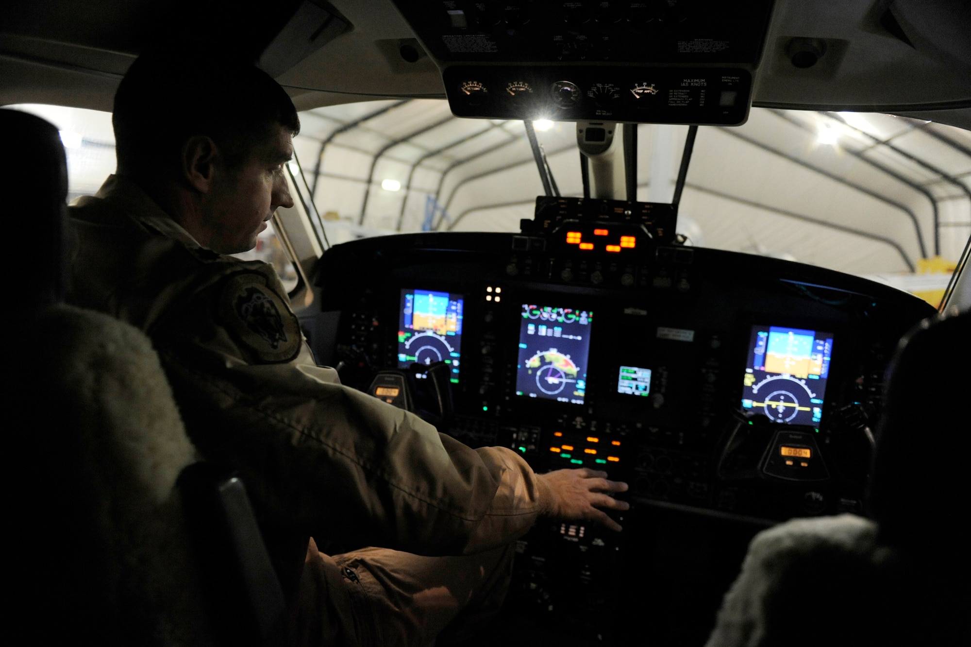 Lt. Col. Rob Weaver, 4th Expeditionary Reconnaissance Squadron director of operations, goes through a routine check of an instrument panel inside the cockpit of an MC-12W Liberty, Feb. 27, 2010, at Bagram Airfield, Afghanistan. The MC-12W Liberty brings tactical intelligence, surveillance and reconnaissance to ground commanders in Afghanistan. (U.S. Air Force photo/Staff Sgt. Manuel J. Martinez/released)