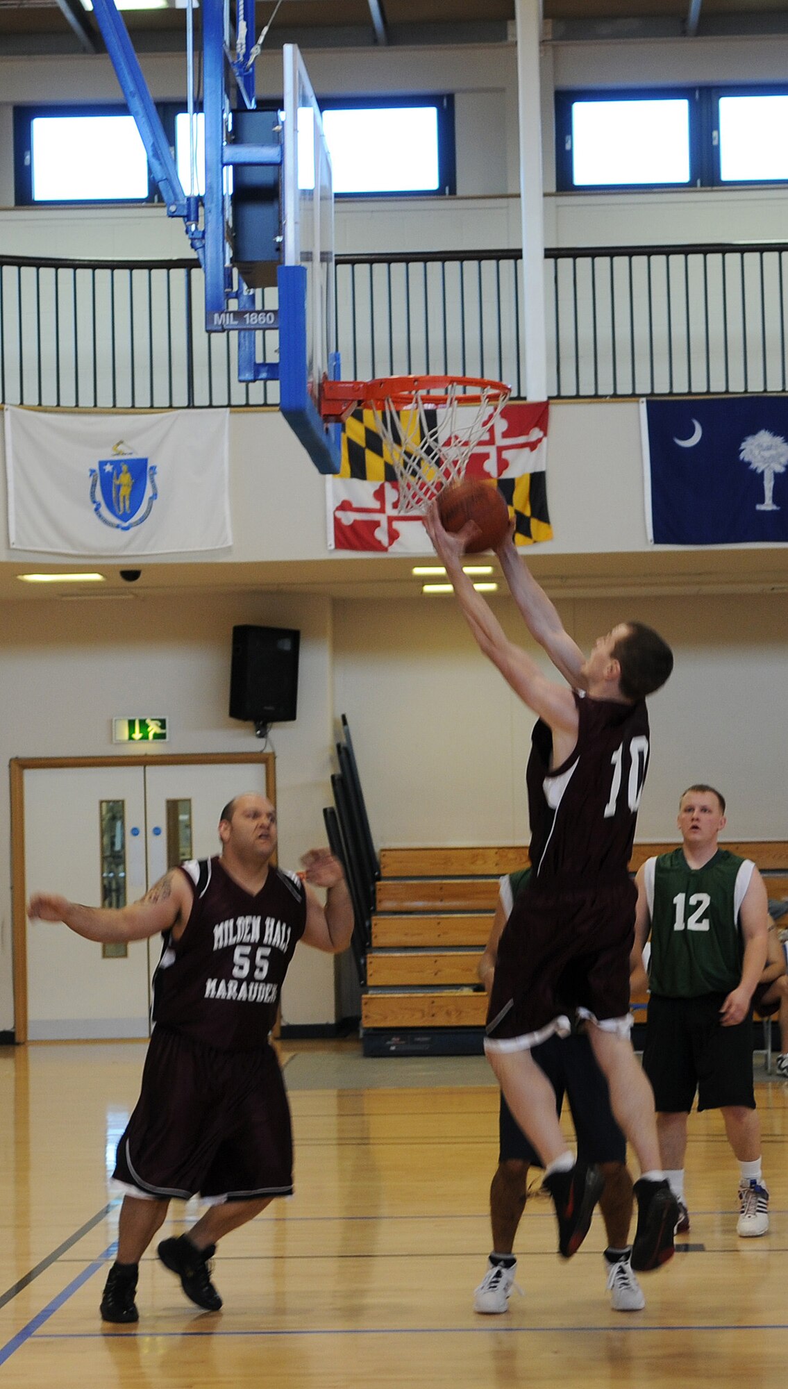 RAF MILDENHALL, England -- Kalen Strunk, RAF Mildenhall Team 1 player, lifts a layup in an attempt to increase the point difference against RAF Lakenheath Team 2 in the opening 2010 U.S. Air Forces in Europe Small Unit/Intramural Basketball Championship game March 4 at the Hardstand Fitness Center. The RAF Mildenhall Marauders started the tournament with a 53-38 final score. The championship games last through March 7 at the Hardstand. (U.S. Air Force photo/Staff Sgt. Thomas Trower)