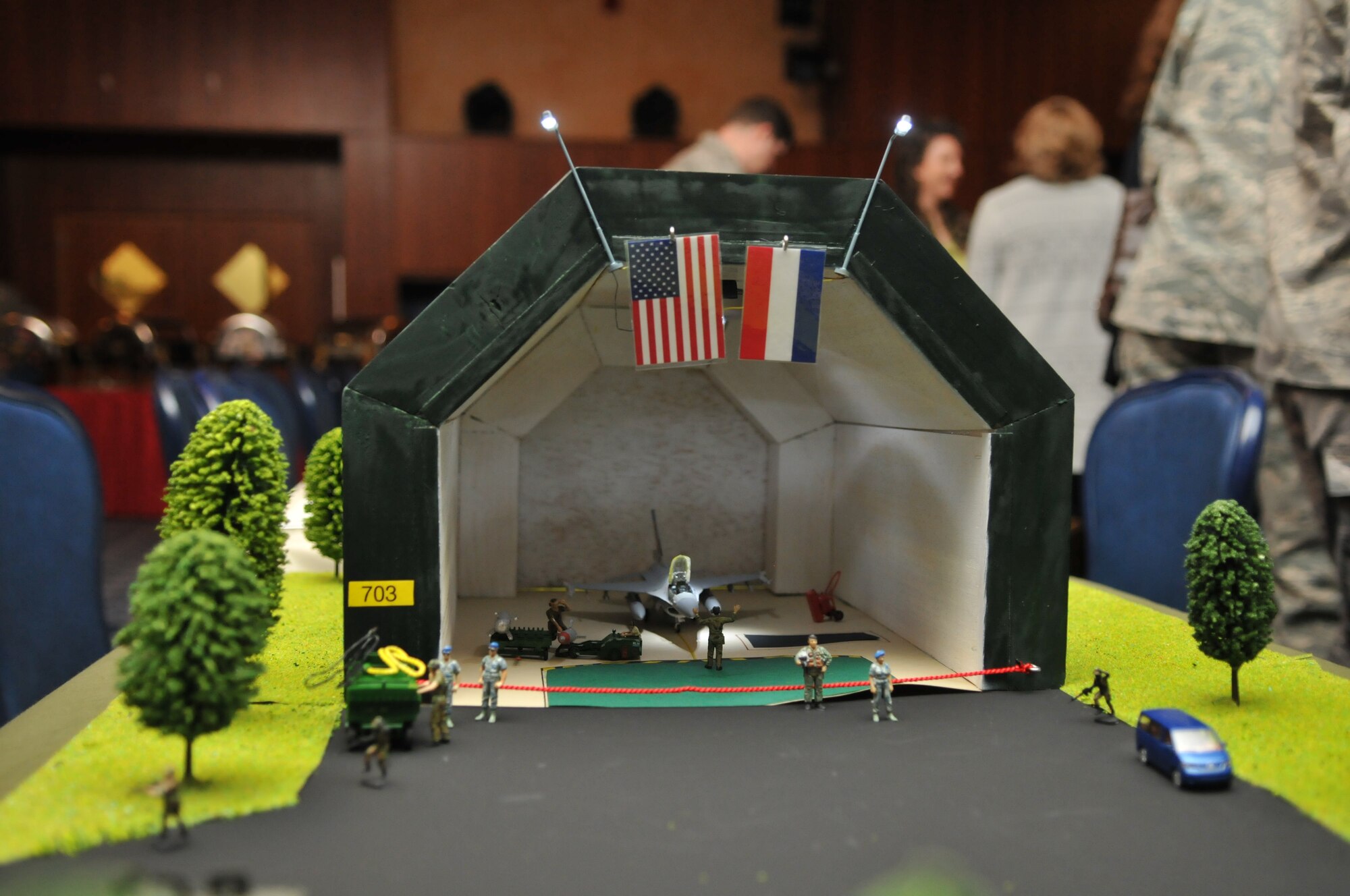 SPANGDAHLEM AIR BASE, Germany – A miniature replica of a hardened aircraft shelter, F-16 Fighting Falcon and load crew lay here on display as a center piece during the 2009 52nd Fighter Wing Maintenance Professional of the Year awards banquet Feb. 27 at Club Eifel. Each table boasted elaborate decorations for a chance to win five one-day passes and group coins. (U.S. Air Force photo/Airman 1st Class Nick Wilson)