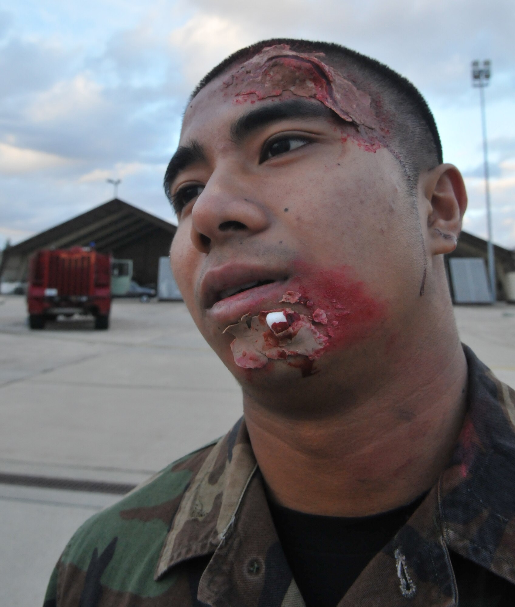 SPANGDAHLEM AIR BASE, Germany – Airman 1st Class Michael King, 52nd Component Maintenance Squadron, awaits medical aid as 52nd Civil Engineer Squadron firefighters respond after a simulated car accident during Operation Saber Crown 10-04 here March 1. Members of the 52nd Fighter Wing participated in the Phase II exercise to evaluate the wing’s ability to survive and operate in a chemical, biological, radiological, nuclear and explosive environment. (U.S. Air Force photo/Airman 1st Class Nick Wilson)