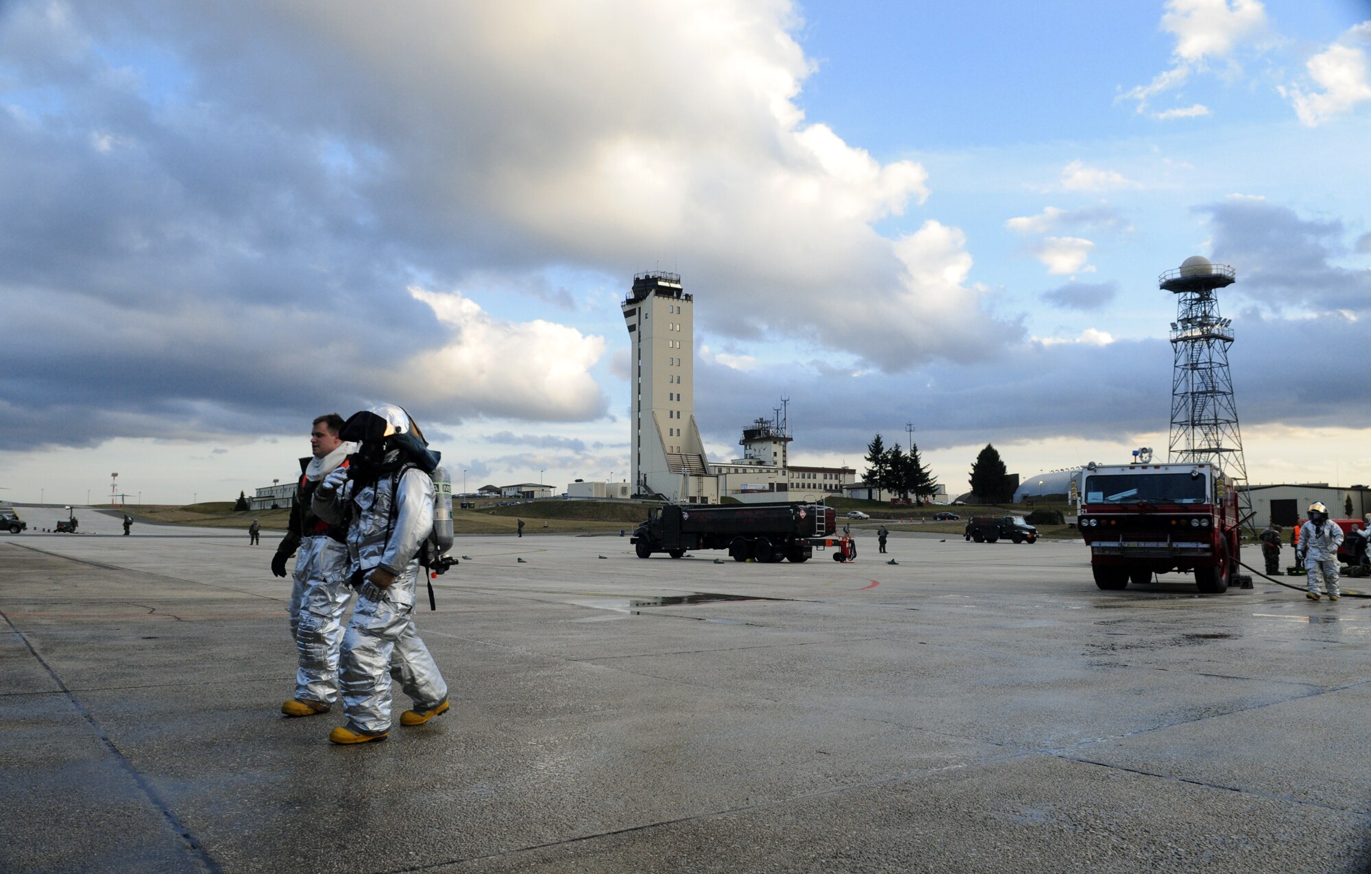 SPANGDAHLEM AIR BASE, Germany – Firefighters from the 52nd Civil Engineer Squadron Fire Department race back to the scene of a simulated car accident during Operation Saber Crown 10-04 here March 1. Members of the 52nd Fighter Wing participated in the Phase II exercise to evaluate the wing’s ability to survive and operate in a chemical, biological, radiological, nuclear and explosive environment. (U.S. Air Force photo/Senior Airman Nathanael Callon)