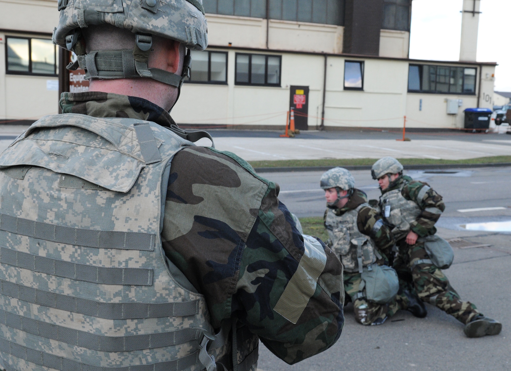 SPANGDAHLEM AIR BASE, Germany – Tech. Sgt. Tom Wagner, 52nd Security Forces Squadron, provides overwatch as his counterpart arrests a member who abandoned his post as part of a simulation during Operation Saber Crown 10-04 here March 1. Members of the 52nd Fighter Wing participated in the Phase II exercise to evaluate the wing’s ability to survive and operate in a chemical, biological, radiological, nuclear and explosive environment. (U.S. Air Force photo/Senior Airman Nathanael Callon)