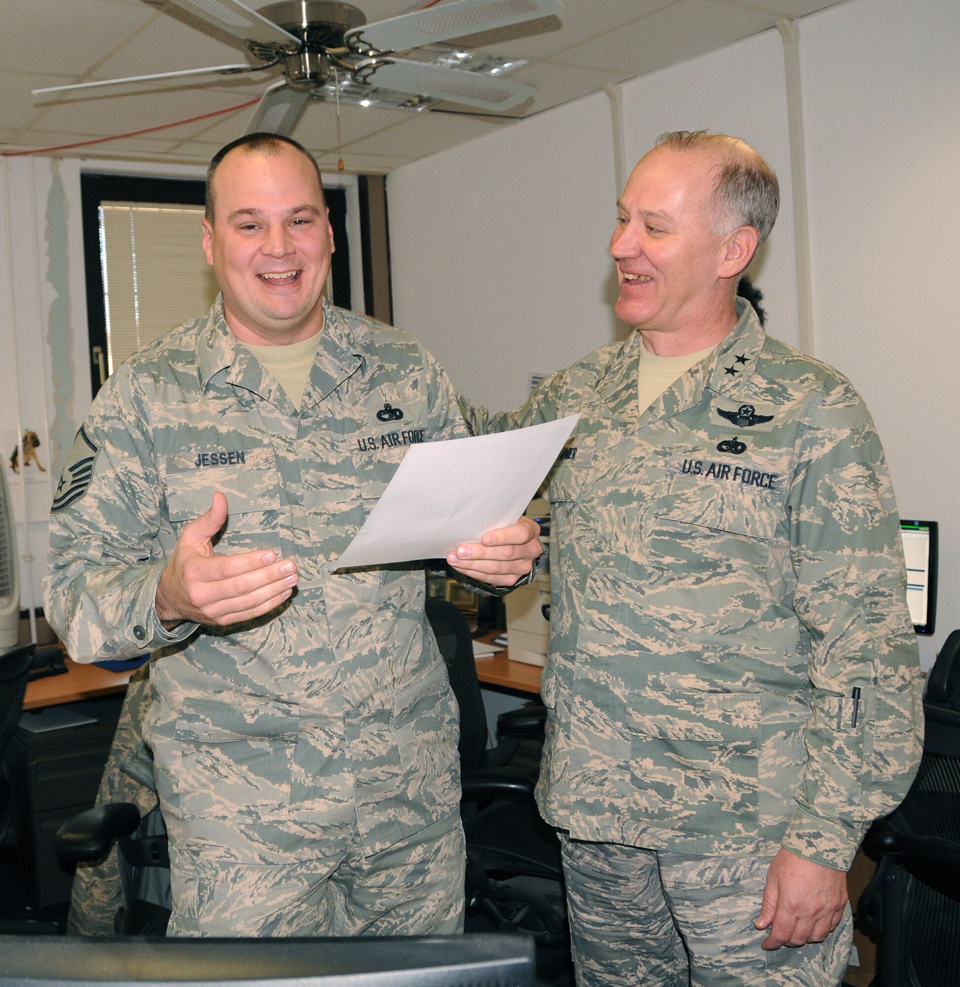 Senior Master Sgt. (select) Scott Jessen, 17th Air Force Air Transportation manager, learns about his promotion to E-8 through Maj. Gen. Ronald Ladnier, 17th Air Force commander, March 4. Six master sergeants from 17th AF were selected for promotion to senior master sergeant. (U.S. Air Force photo by Staff Sgt. Stefanie Torres)