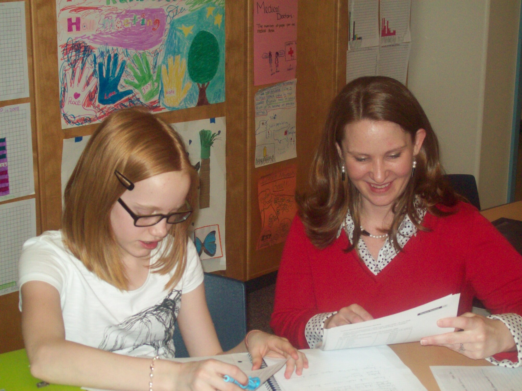 Teacher Shay Wallace works one-on-one with student Anastasia Caldwell-Rutter in social studies class at Osan Middle School. (Photo/Dr. Jennifer Smith)